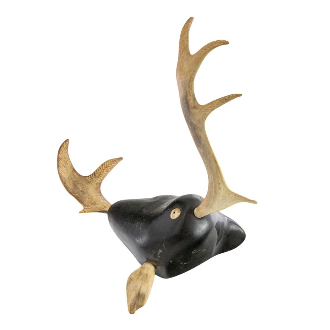 An Inuit serpentine stone and horn figure