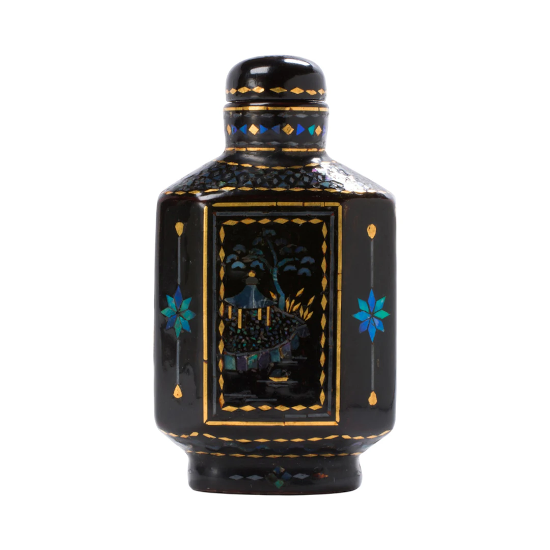 A Chinese lac burguate snuff bottle