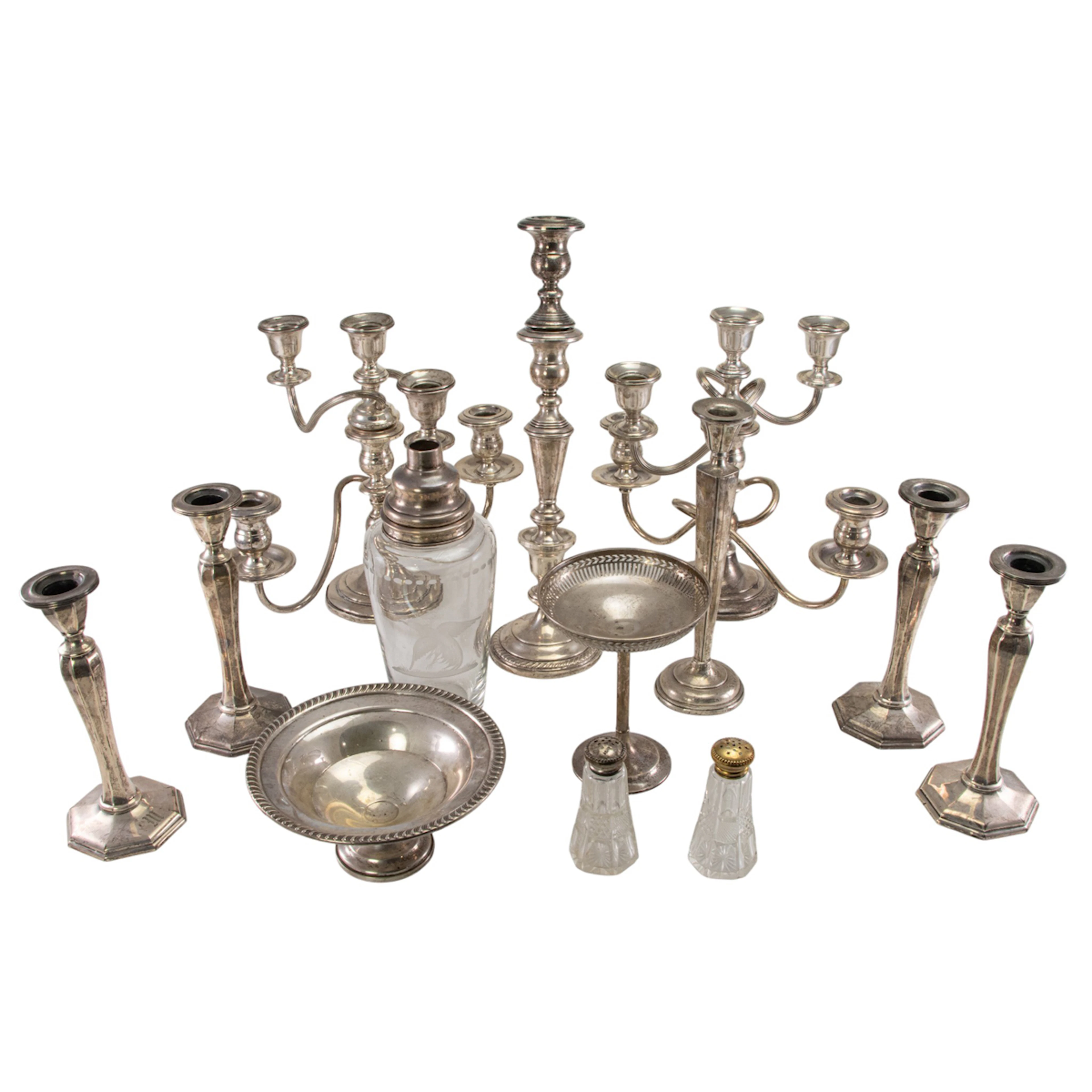 A quantity of damaged sterling weighted and mounted table items