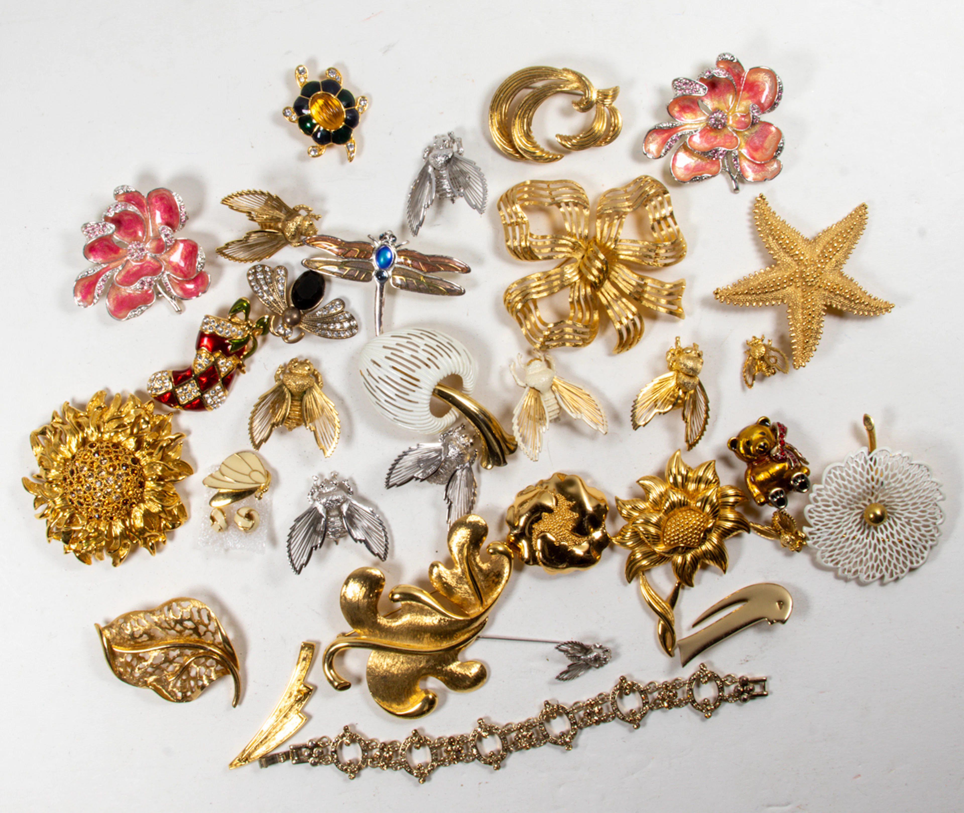 Thirty-two pieces of Monet costume jewelry comprising (30) brooches