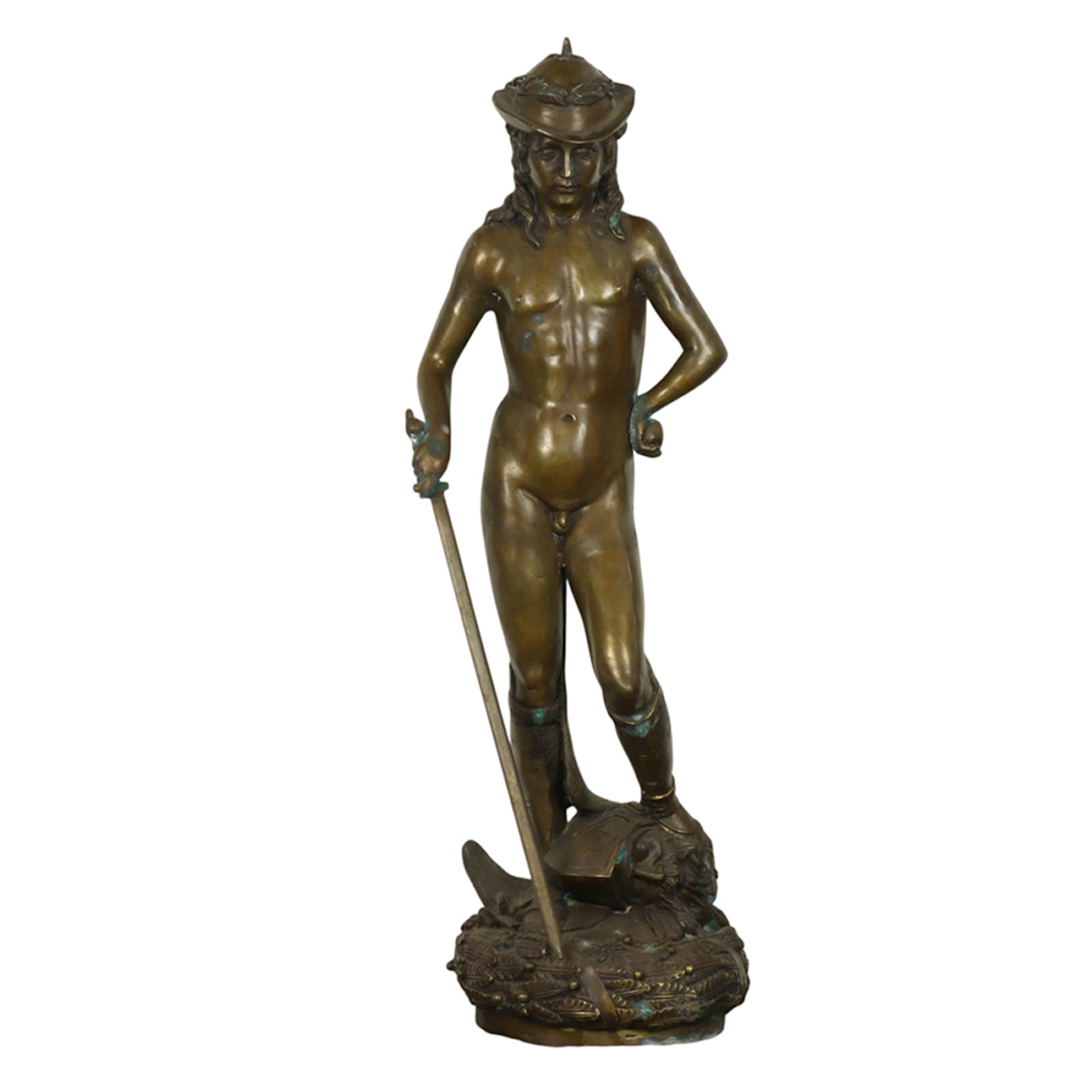 A Continental style patinated bronze figure of David after Donatello
