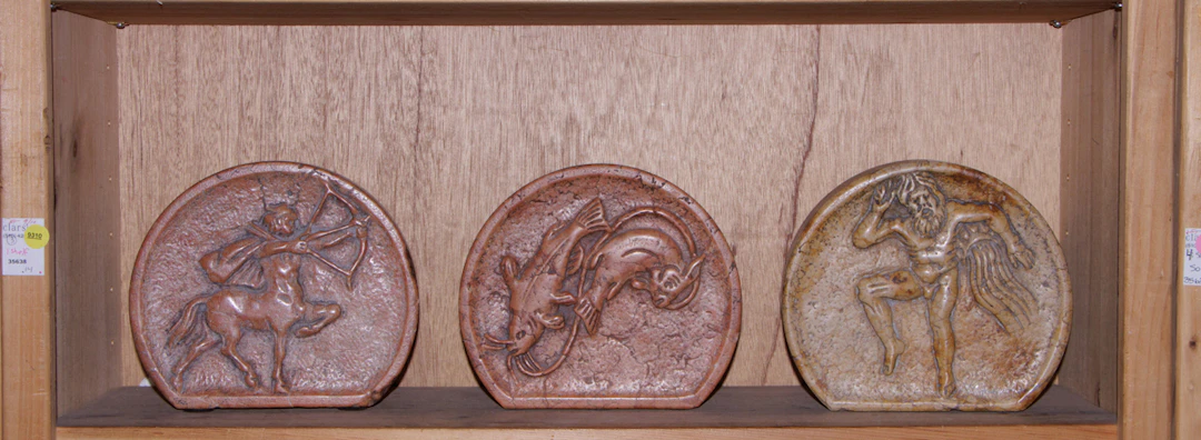 Three small marble carved reliefs