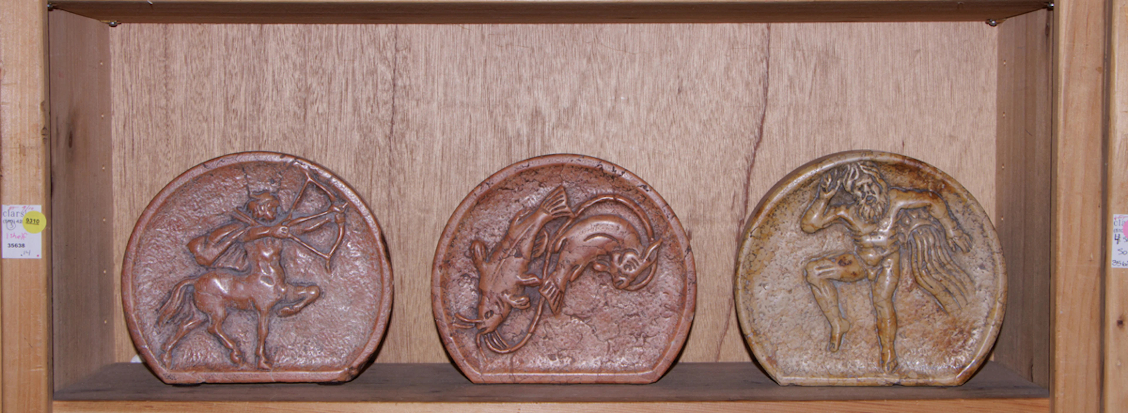 Three small marble carved reliefs