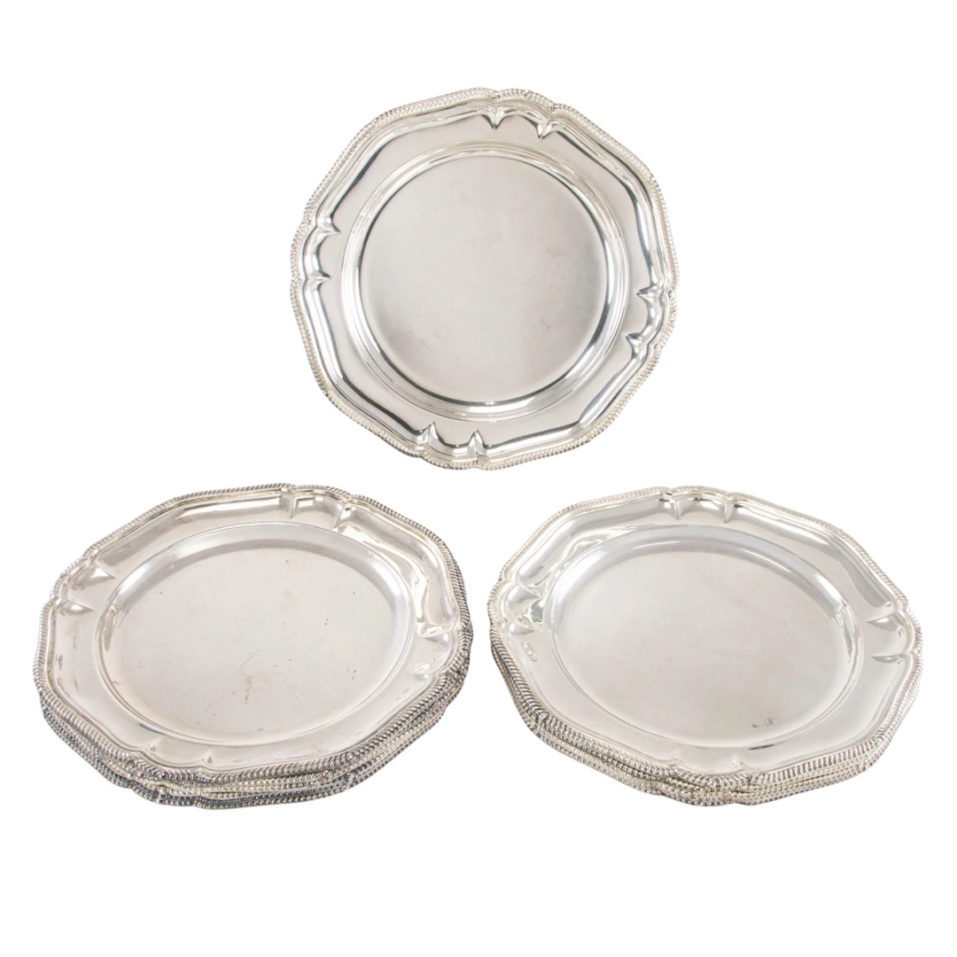 An English plated set of ten place plates with pair copies, Mappin