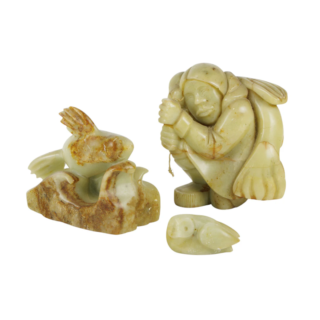 Three Inuit soapstone figures