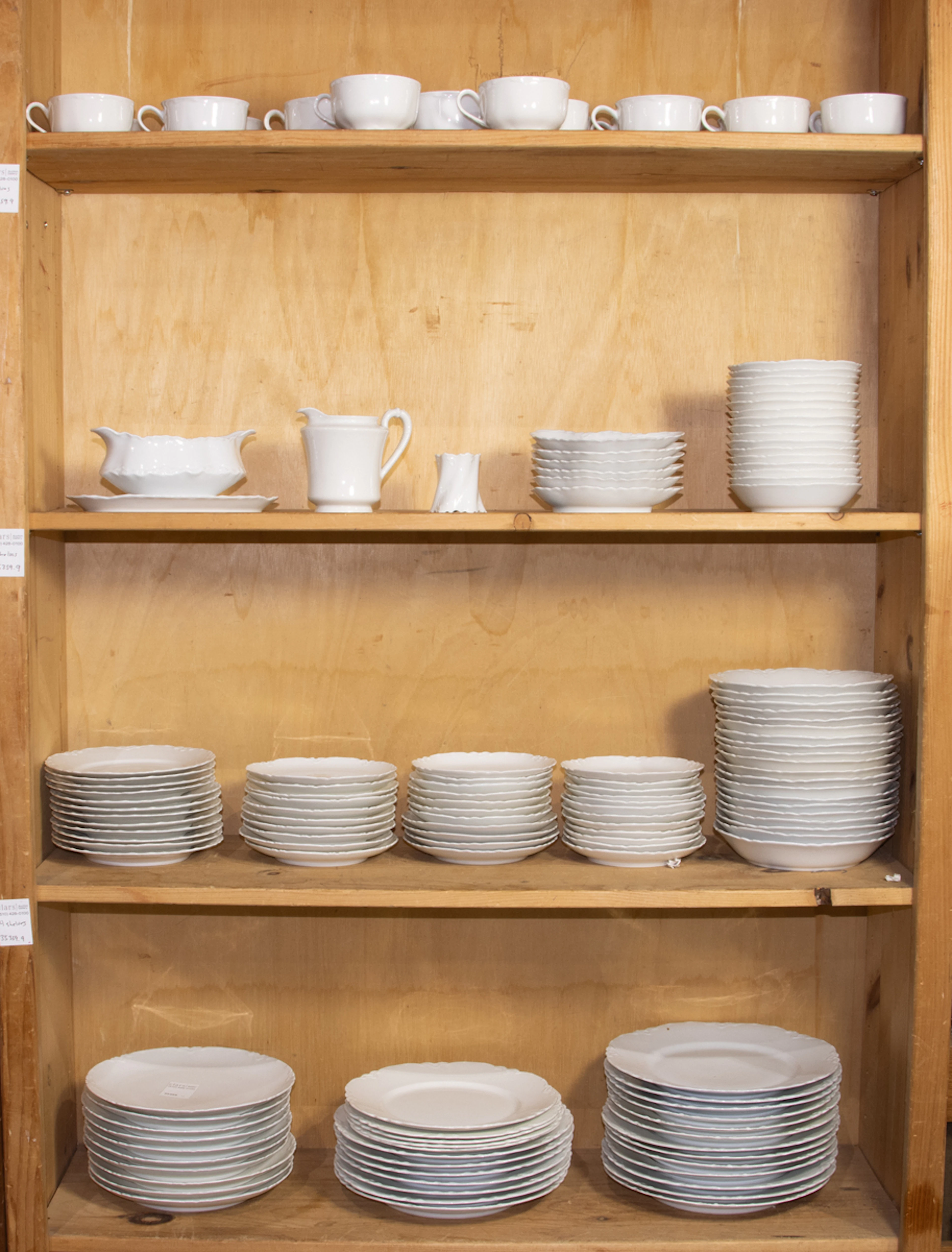 An assembled porcelain dinner service with scalloped edge