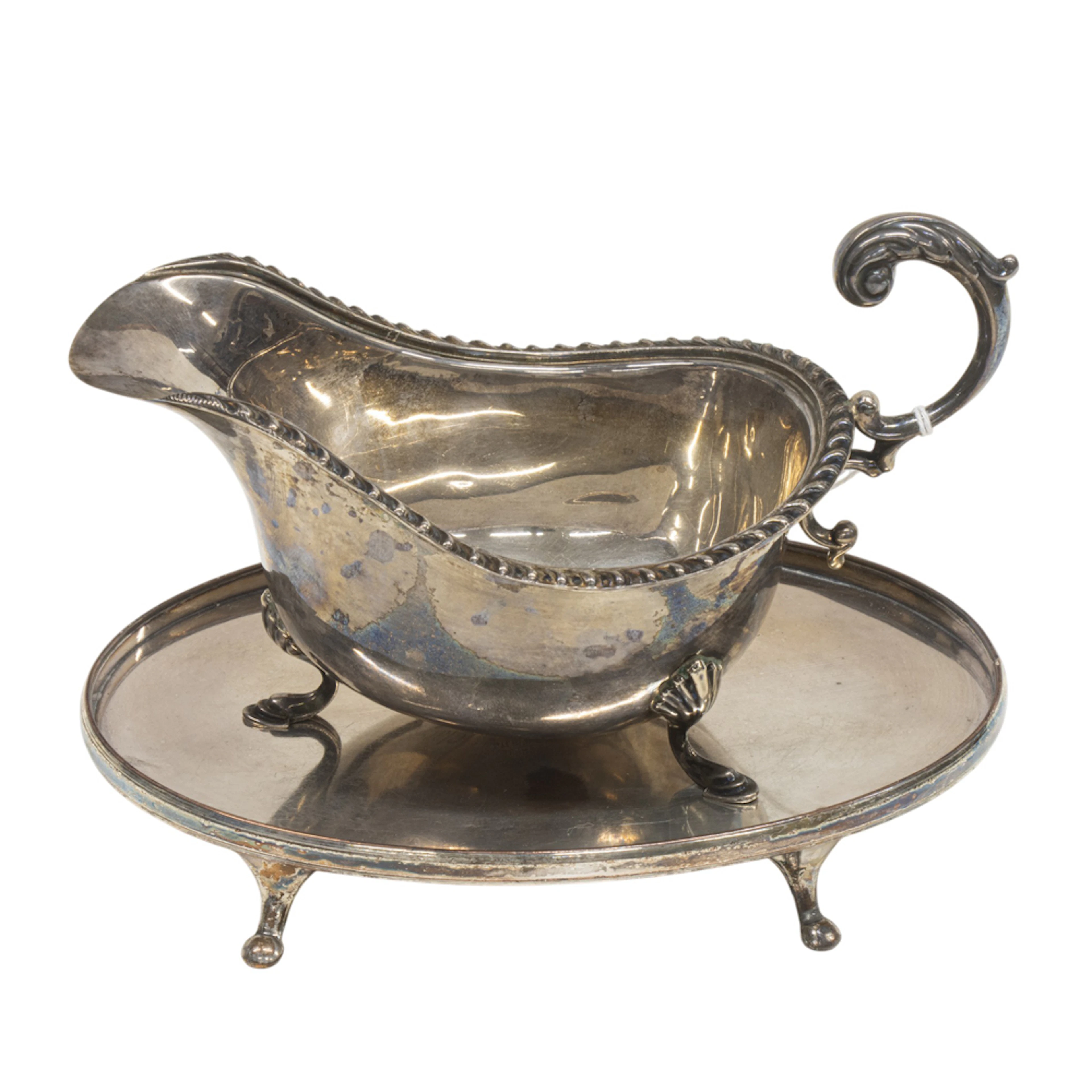 A Canadian sterling tripod sauce boat