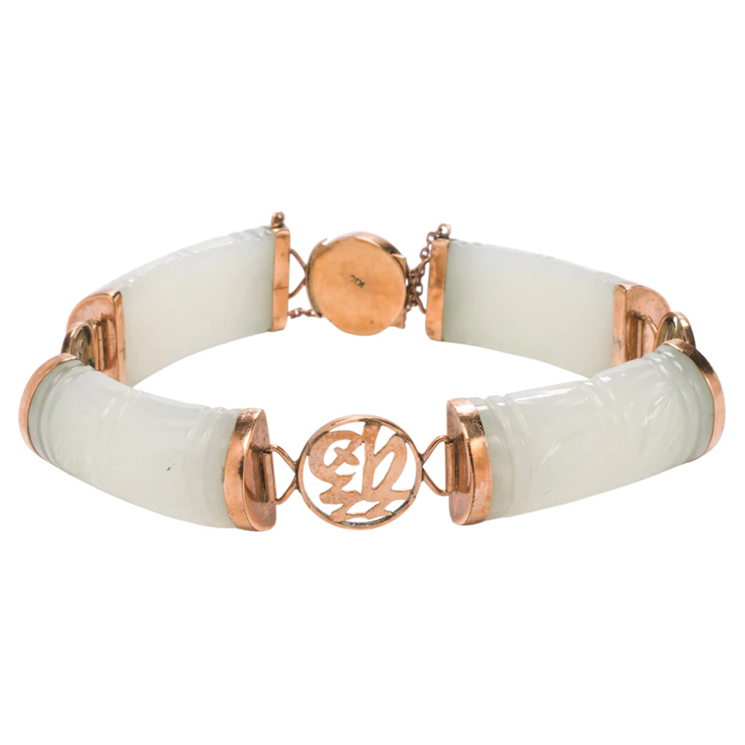 A jade and 10k gold bracelet