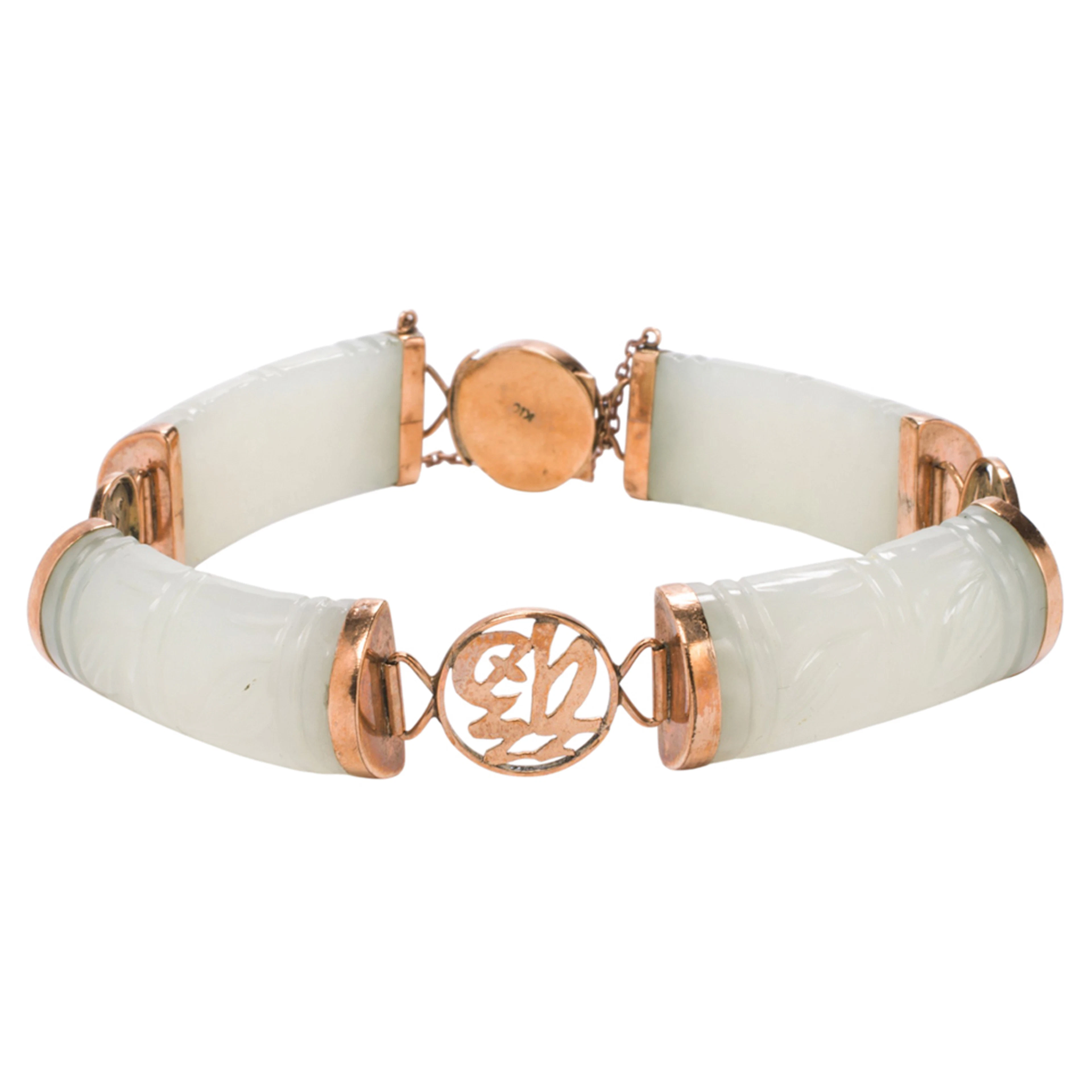 A jade and 10k gold bracelet