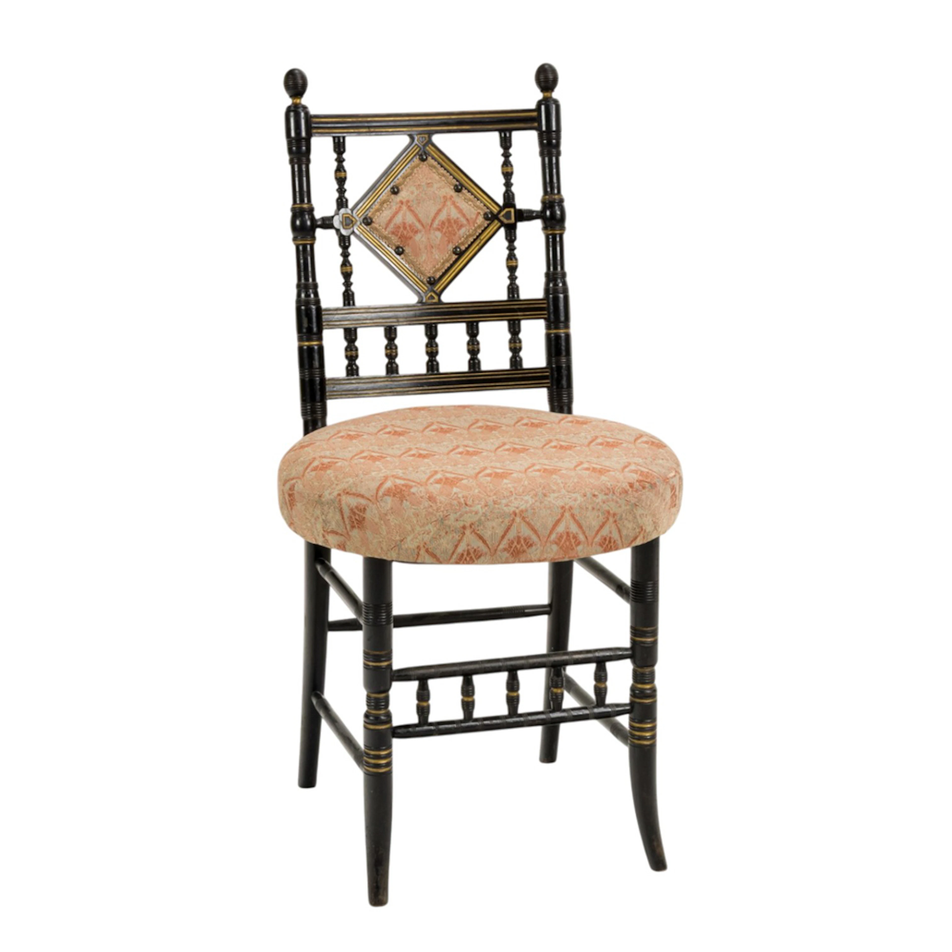 An Aesthetic Movement ebonized and parcel gilt sidechair