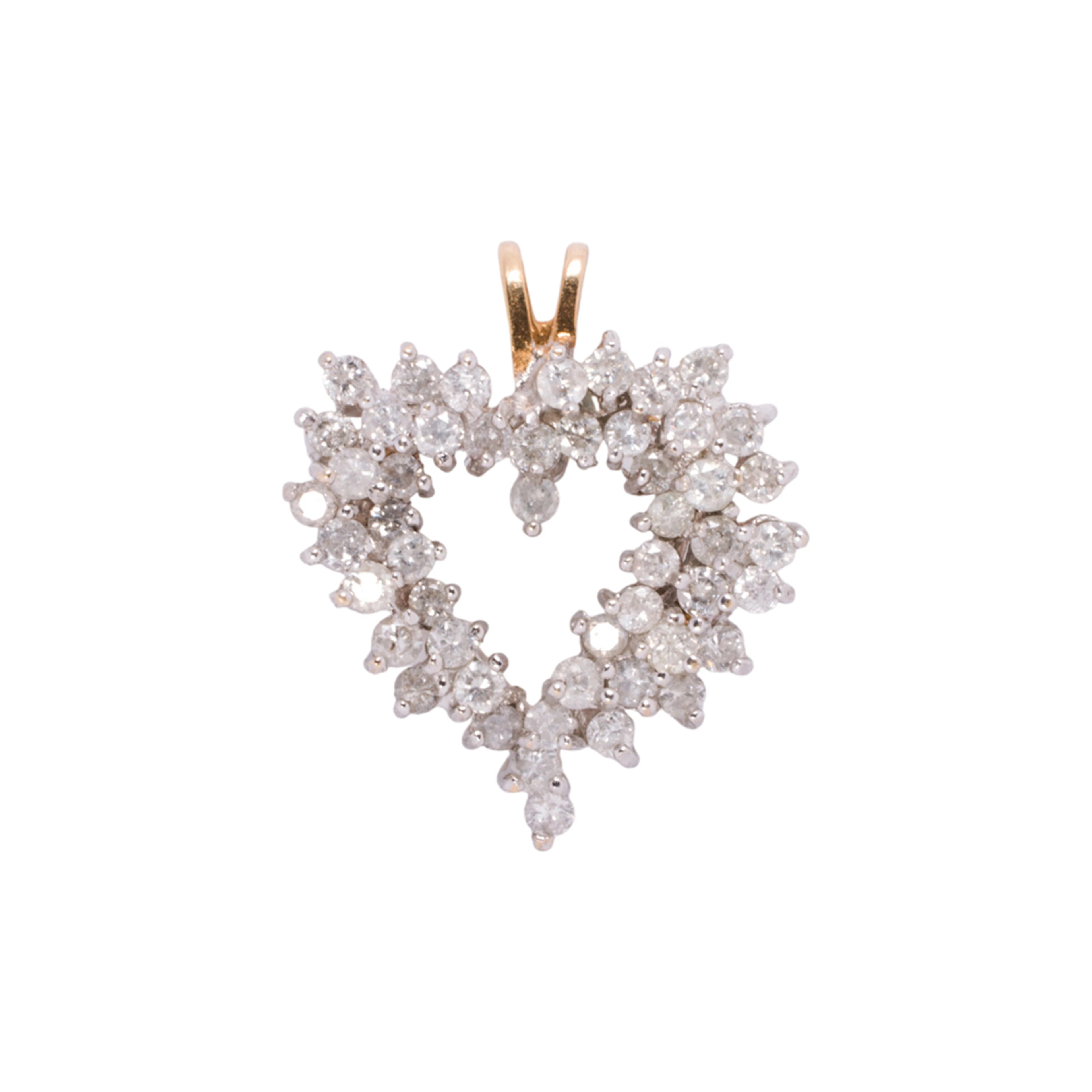 A diamond and 14k gold pendant