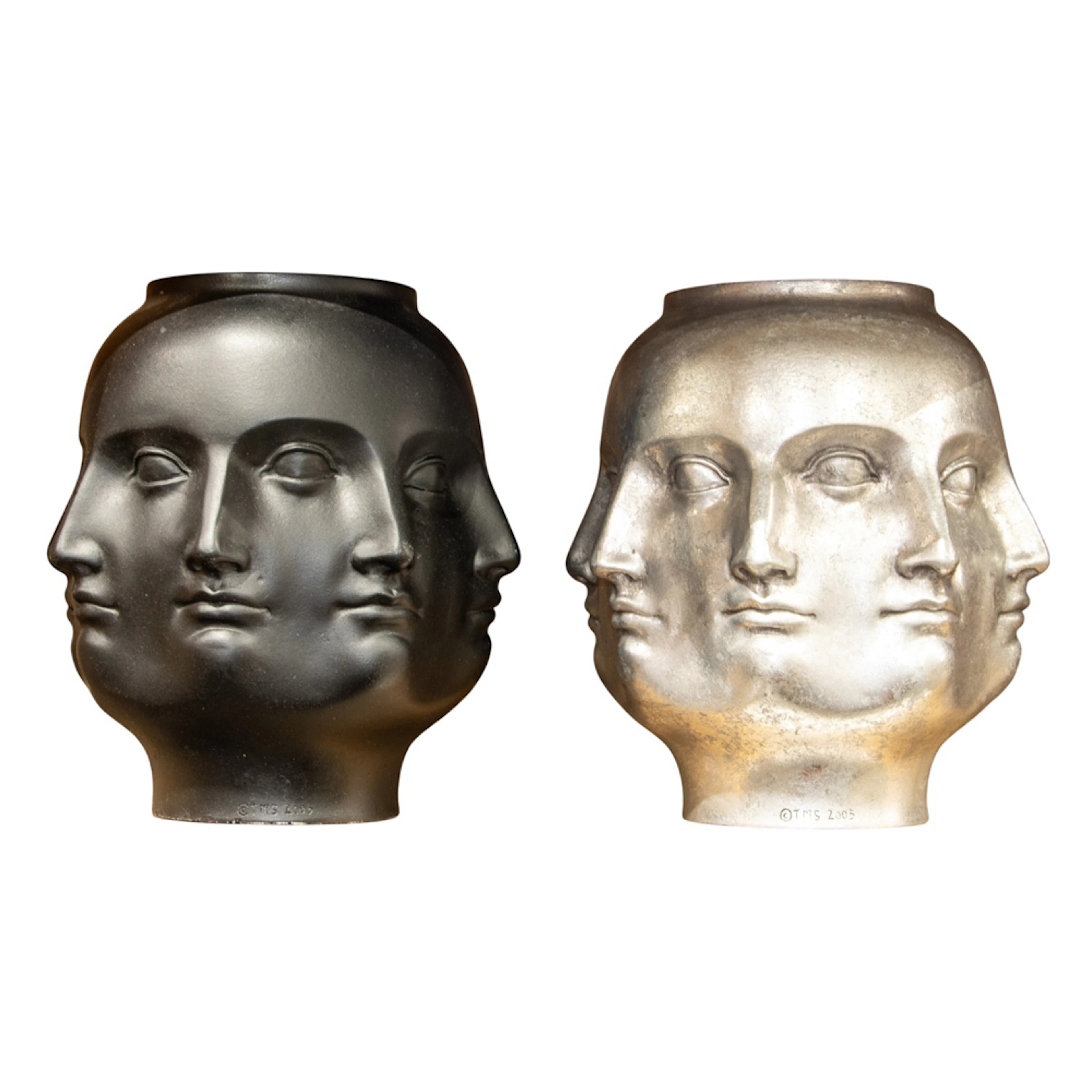 Two Fornasetti style metal Perpetual Face vases