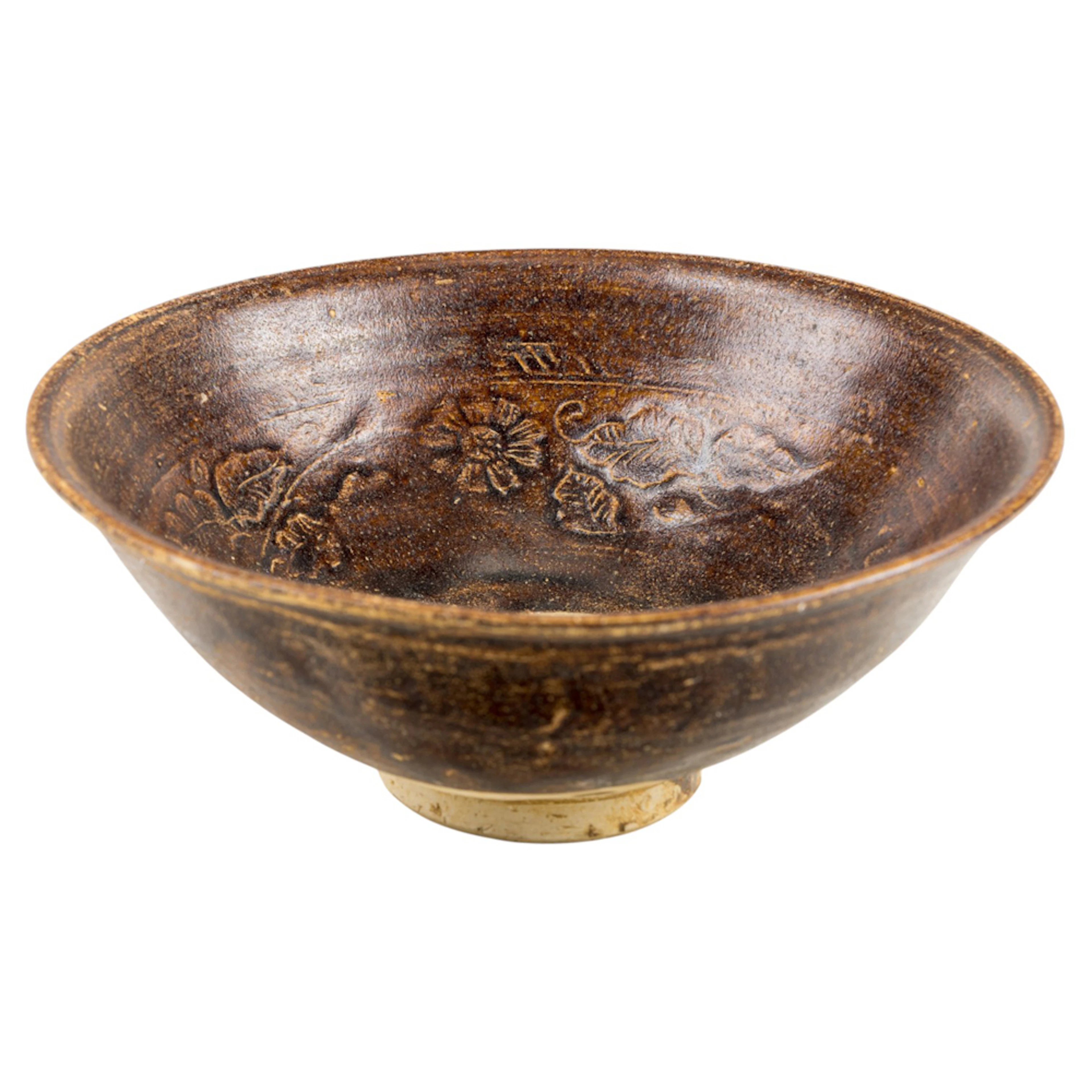 A Vietnamese brown glazed and molded pottery bowl