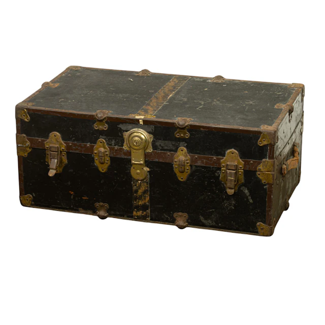 A metal bound steamer trunk