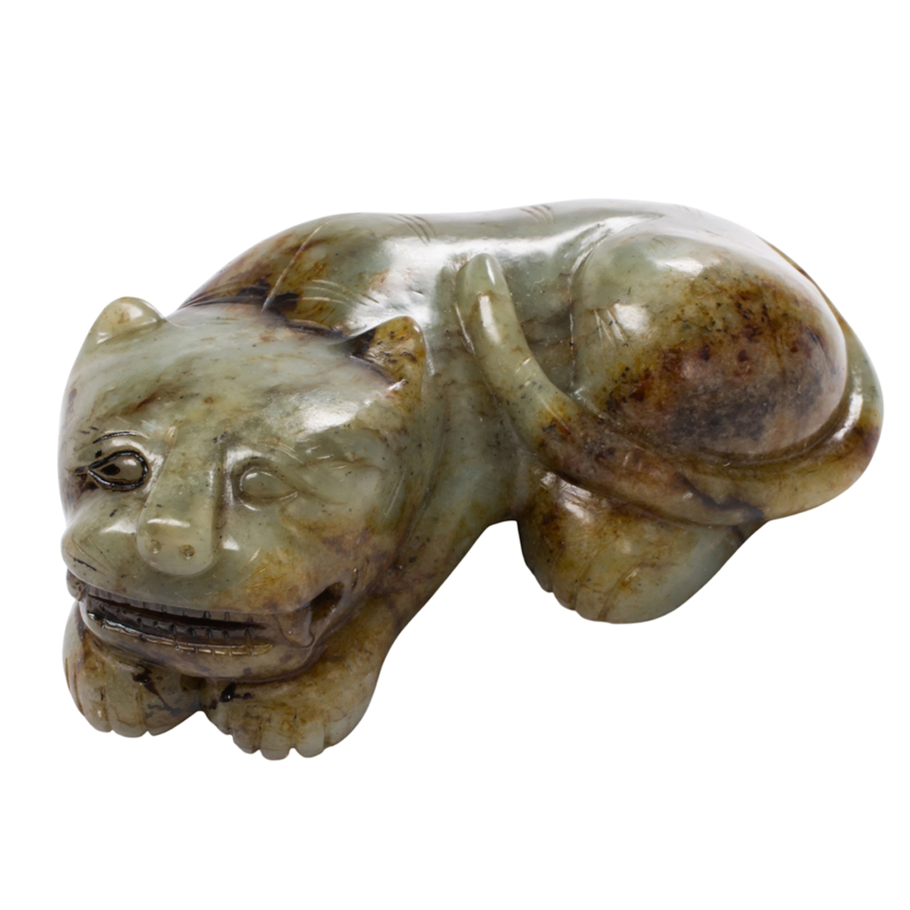 A Chinese celadon jade tiger figure