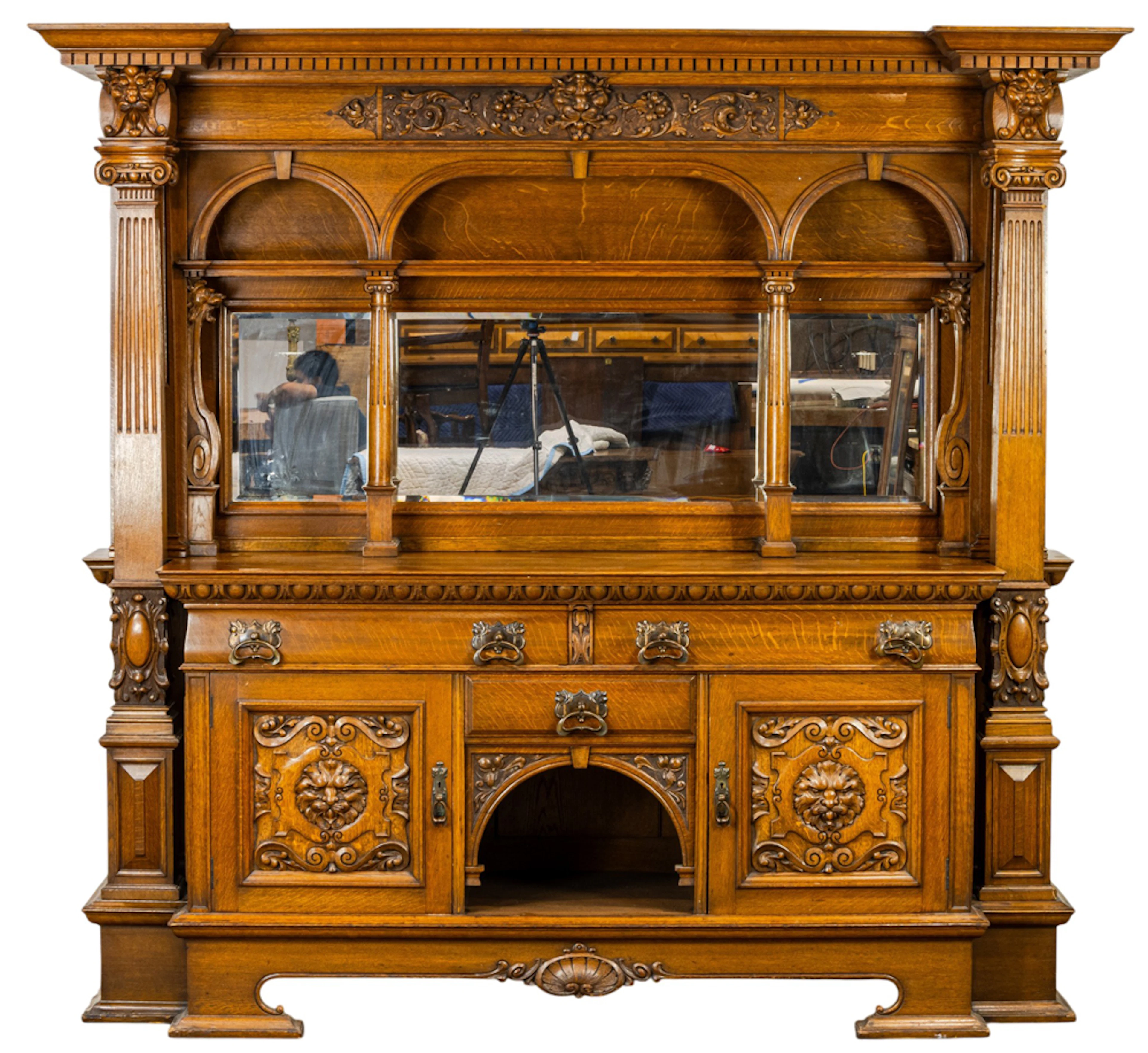 A large Victorian oak bar back or buffet in the style of R.J. Horner