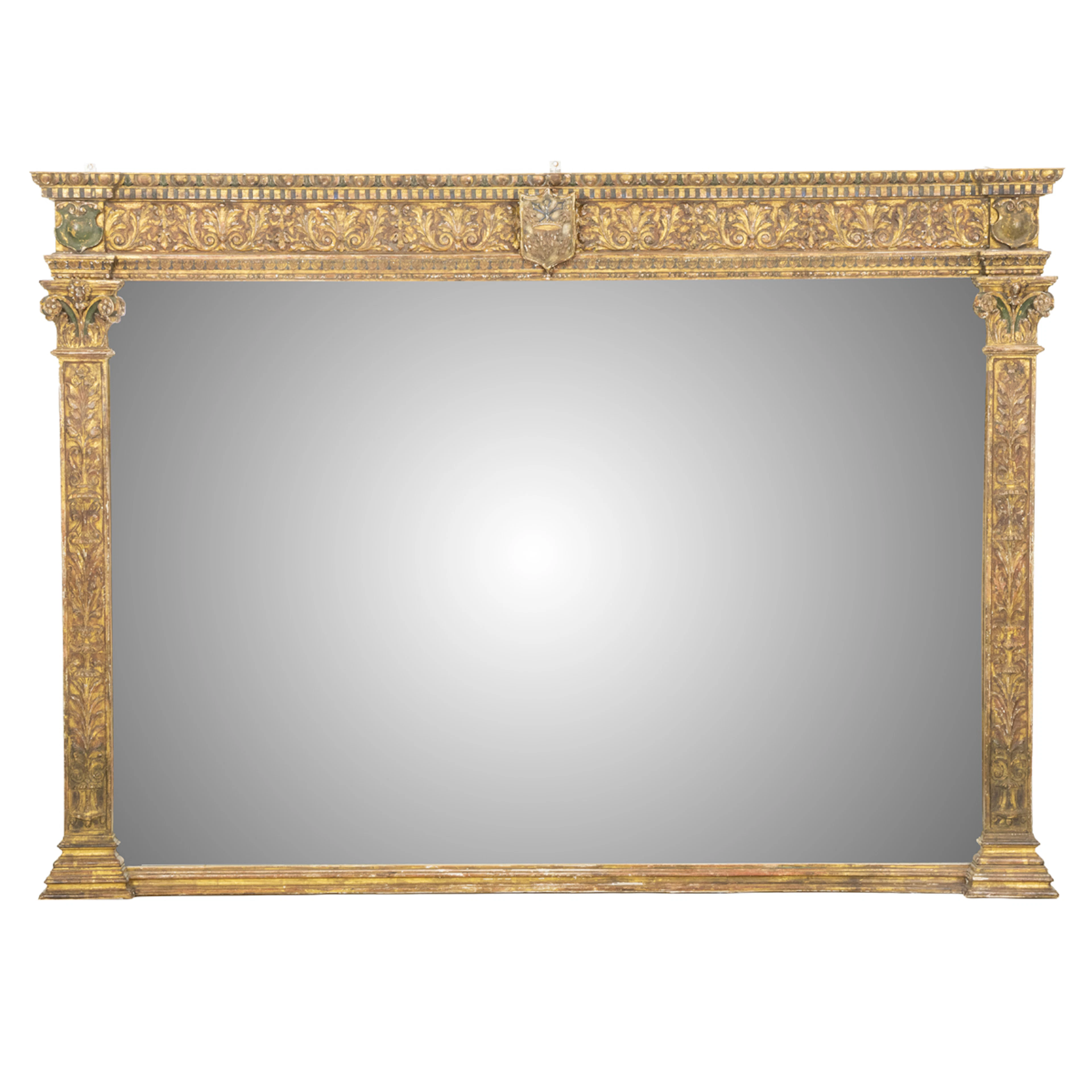 A Renaissance Revival style polychrome and gilt overmantel mirror