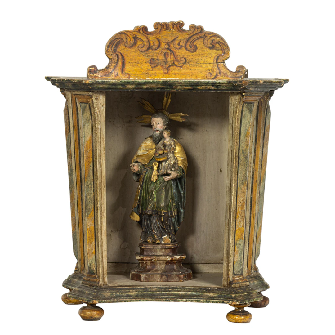 A Continental polychrome faux-marbleized niche with saint