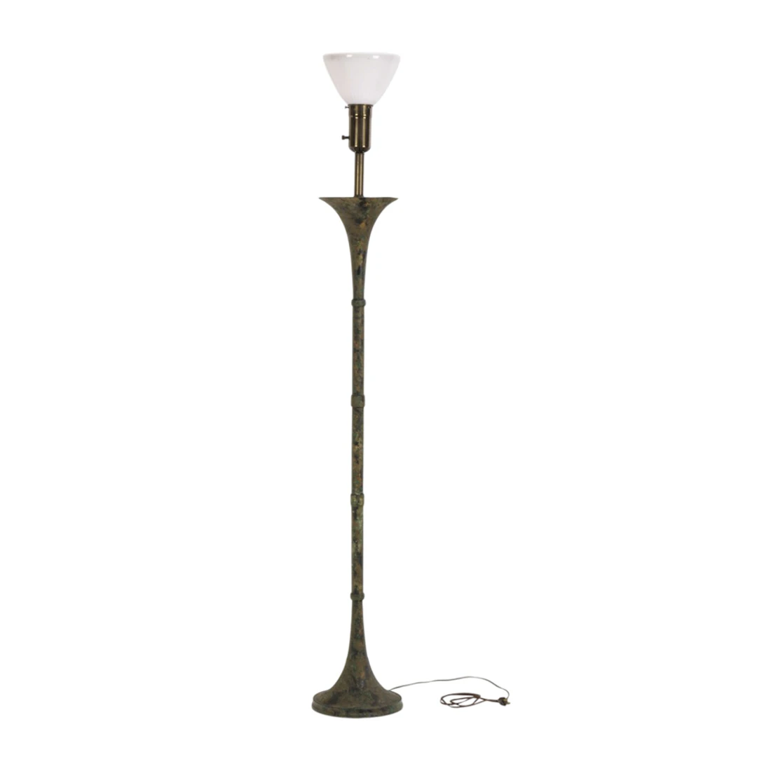 A contemporary verdigris patinated floor lamp in the style of Stewart