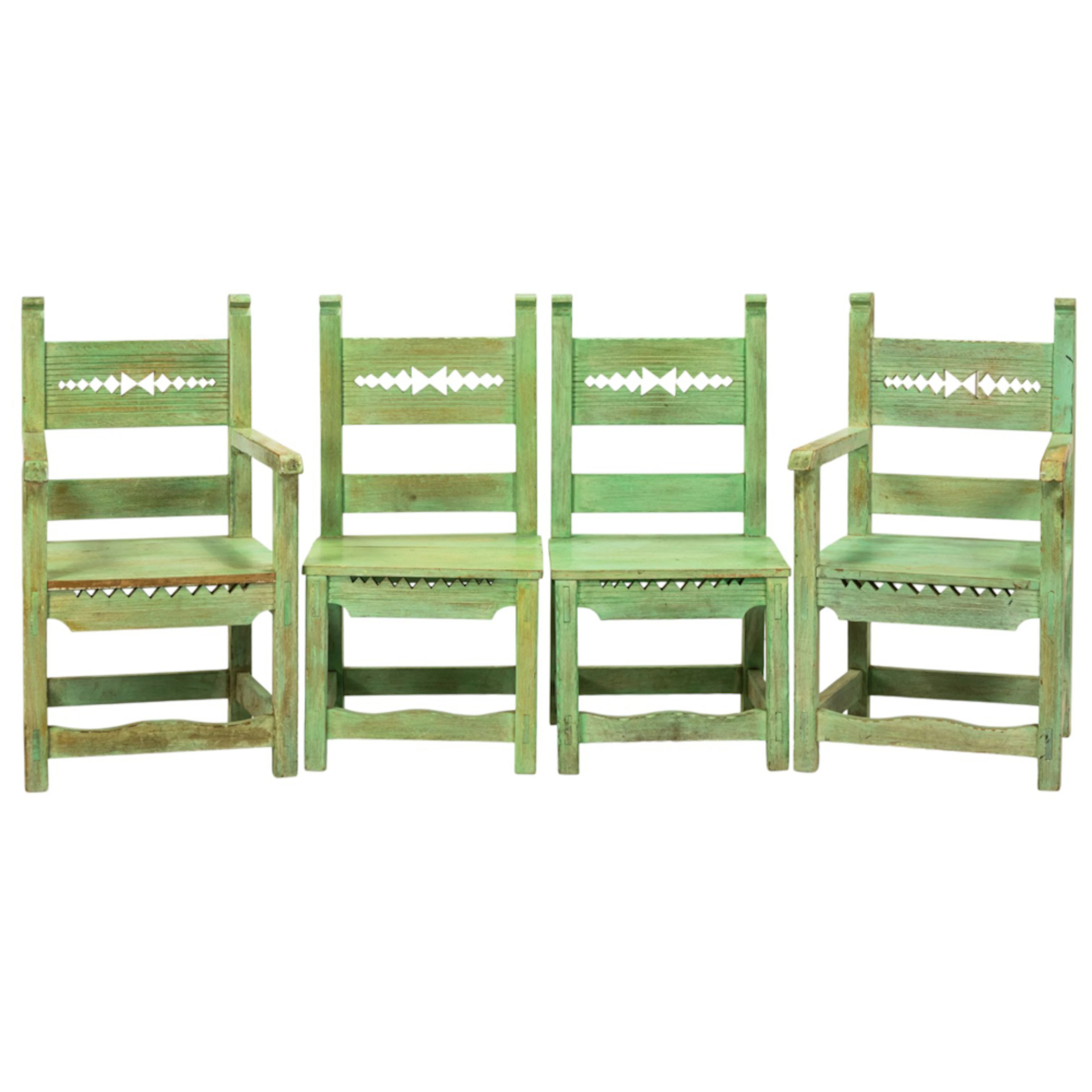A set of four Mexican paint decorated side chairs
