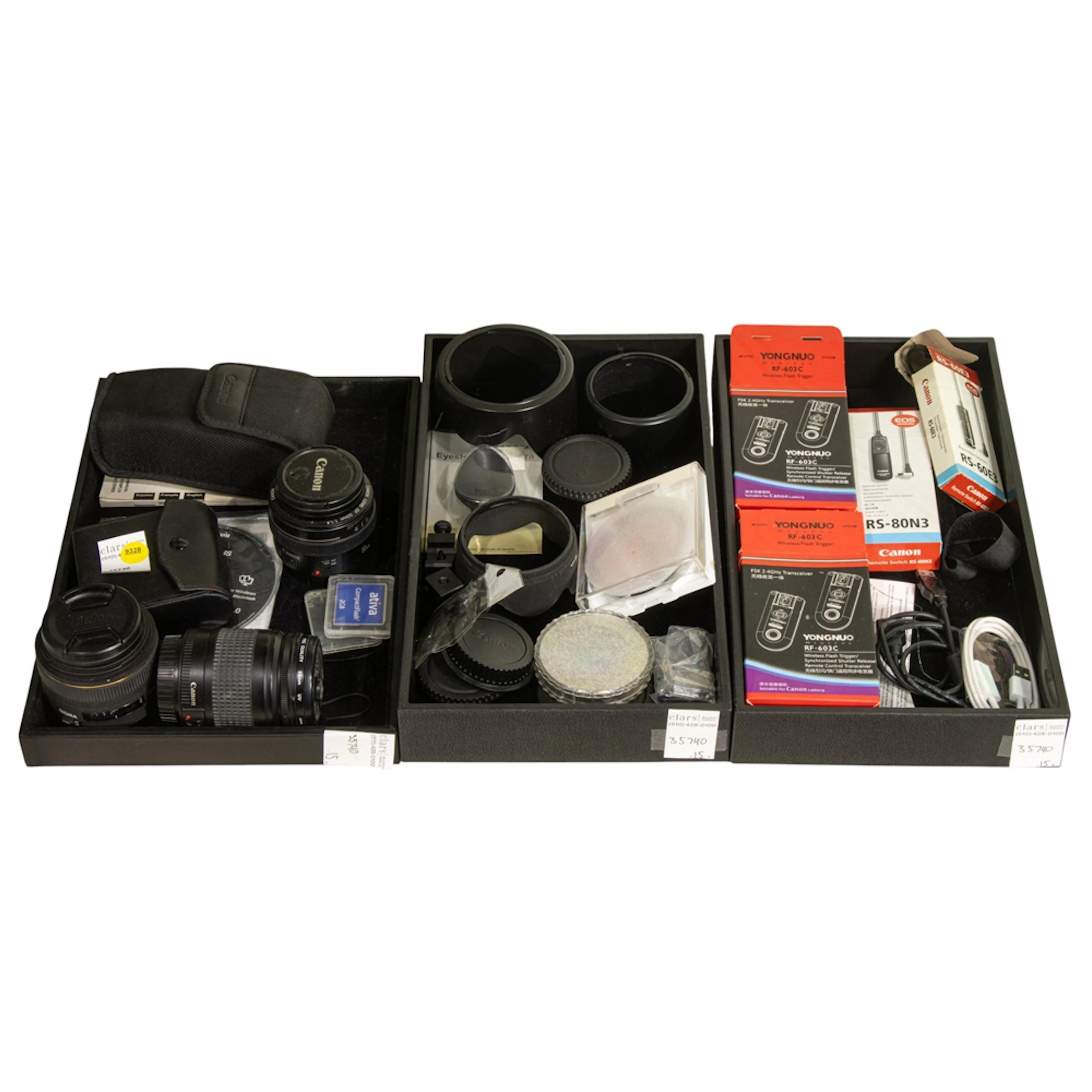 An assembled group of mainly camera lenses and accessories