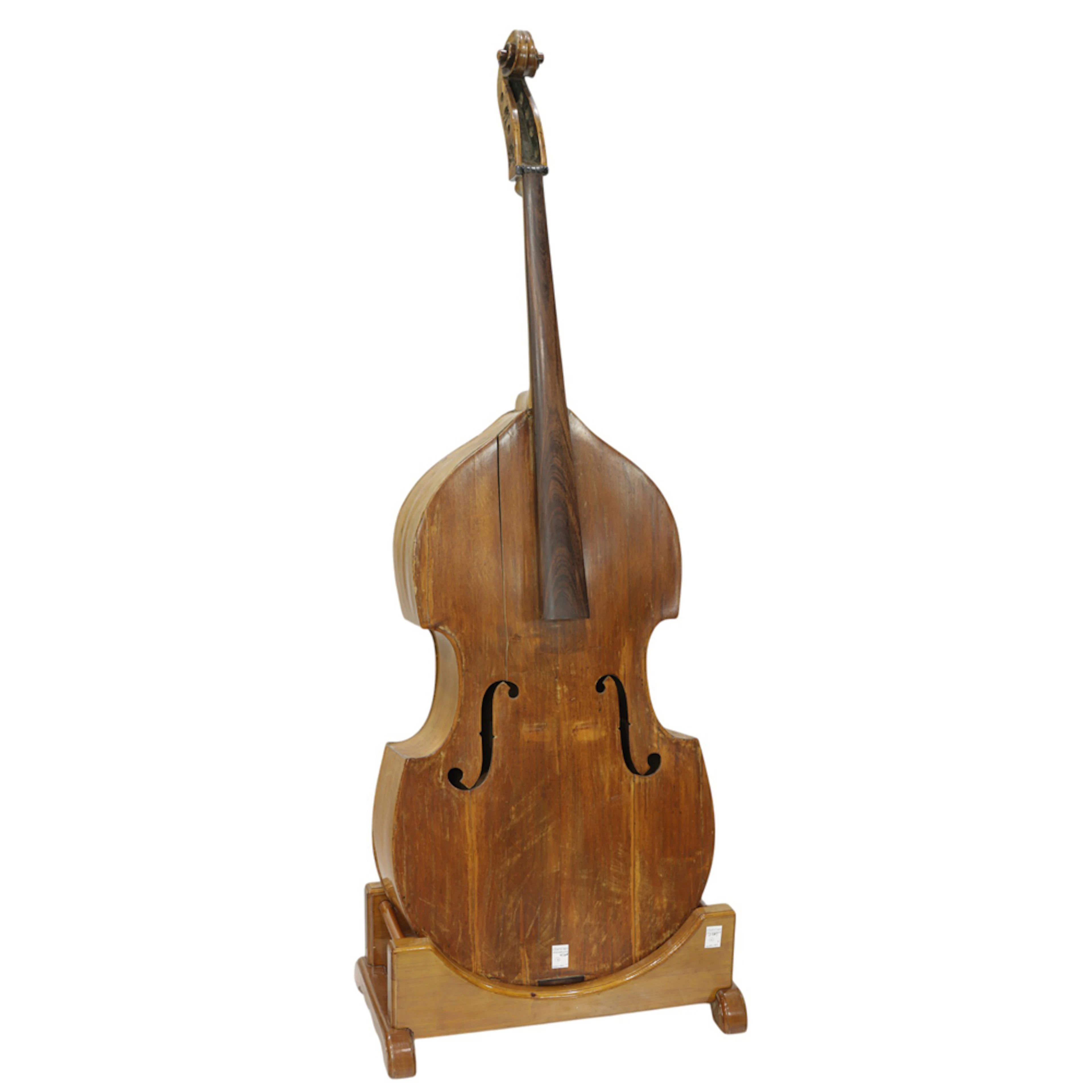 An antique upright bass on stand