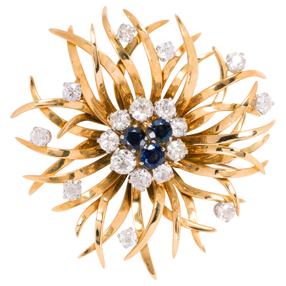 A diamond, sapphire and 18k gold brooch