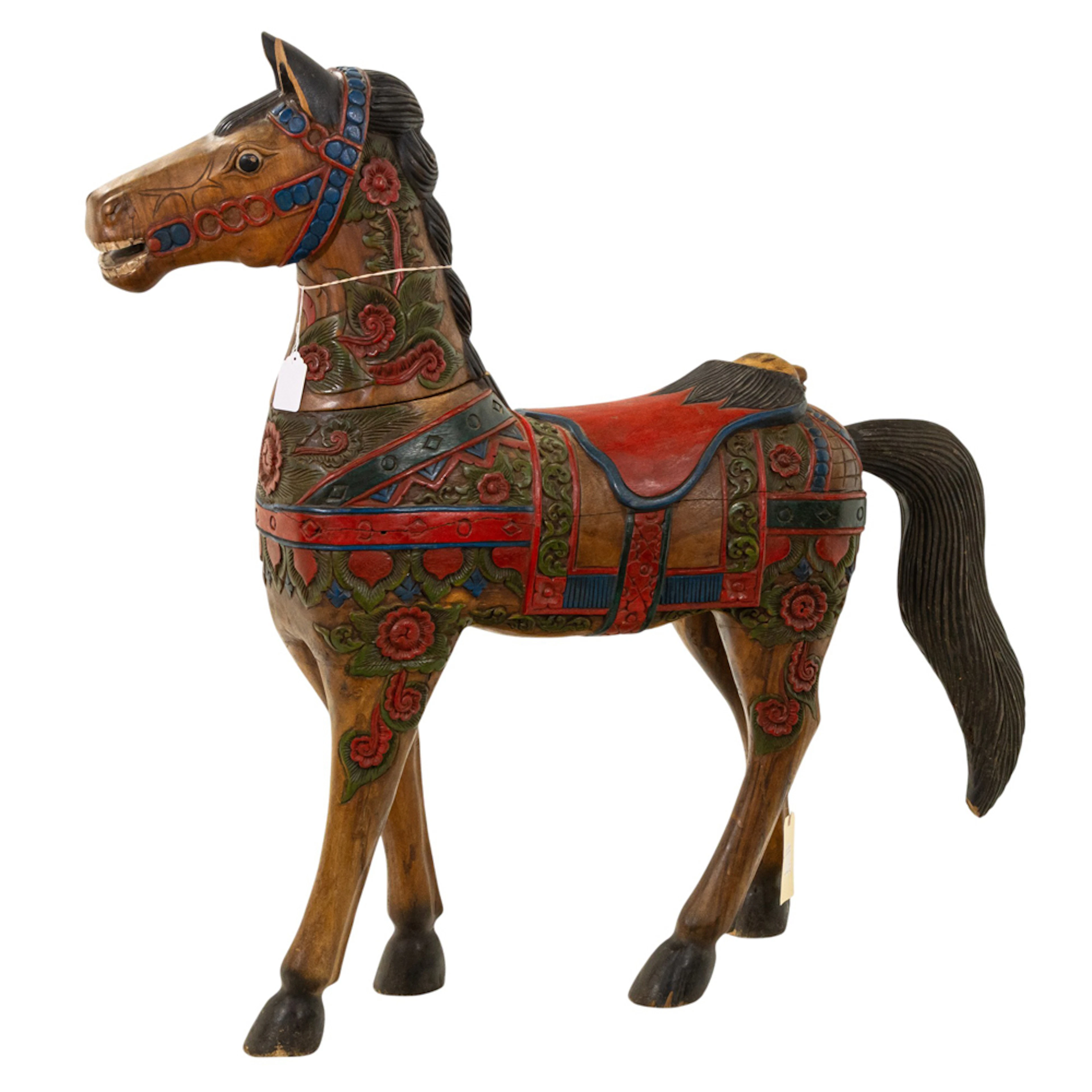 A Mexican carved and paint decorated carousel style horse