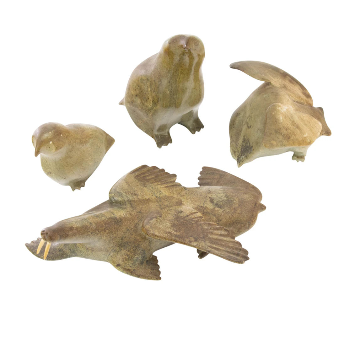 Four Inuit carved stone animals