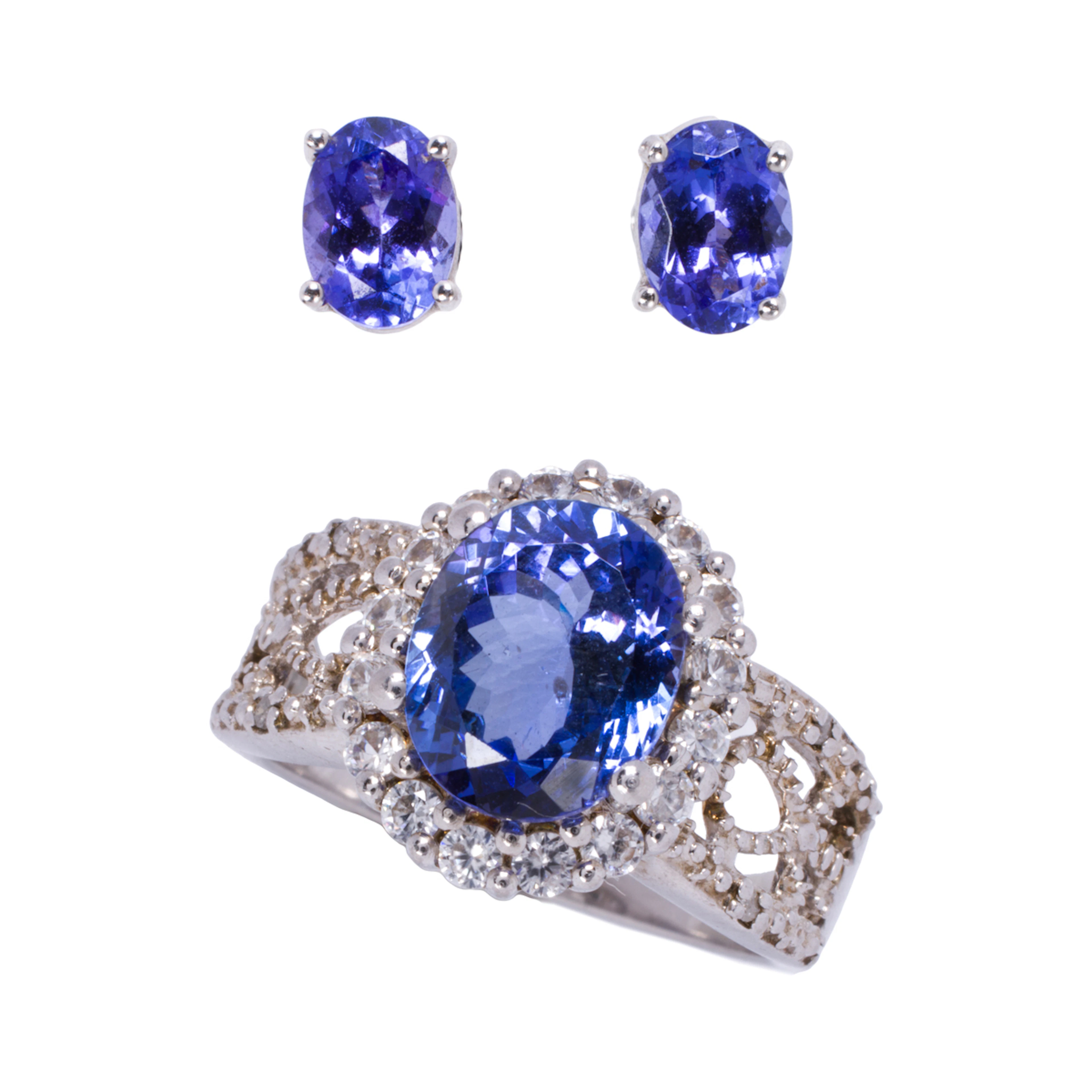 A tanzanite, 14k white gold, and silver ring and earrings