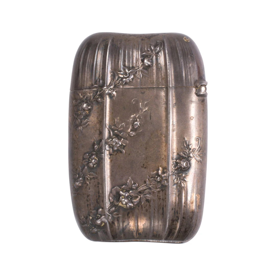 An antique sterling silver match case