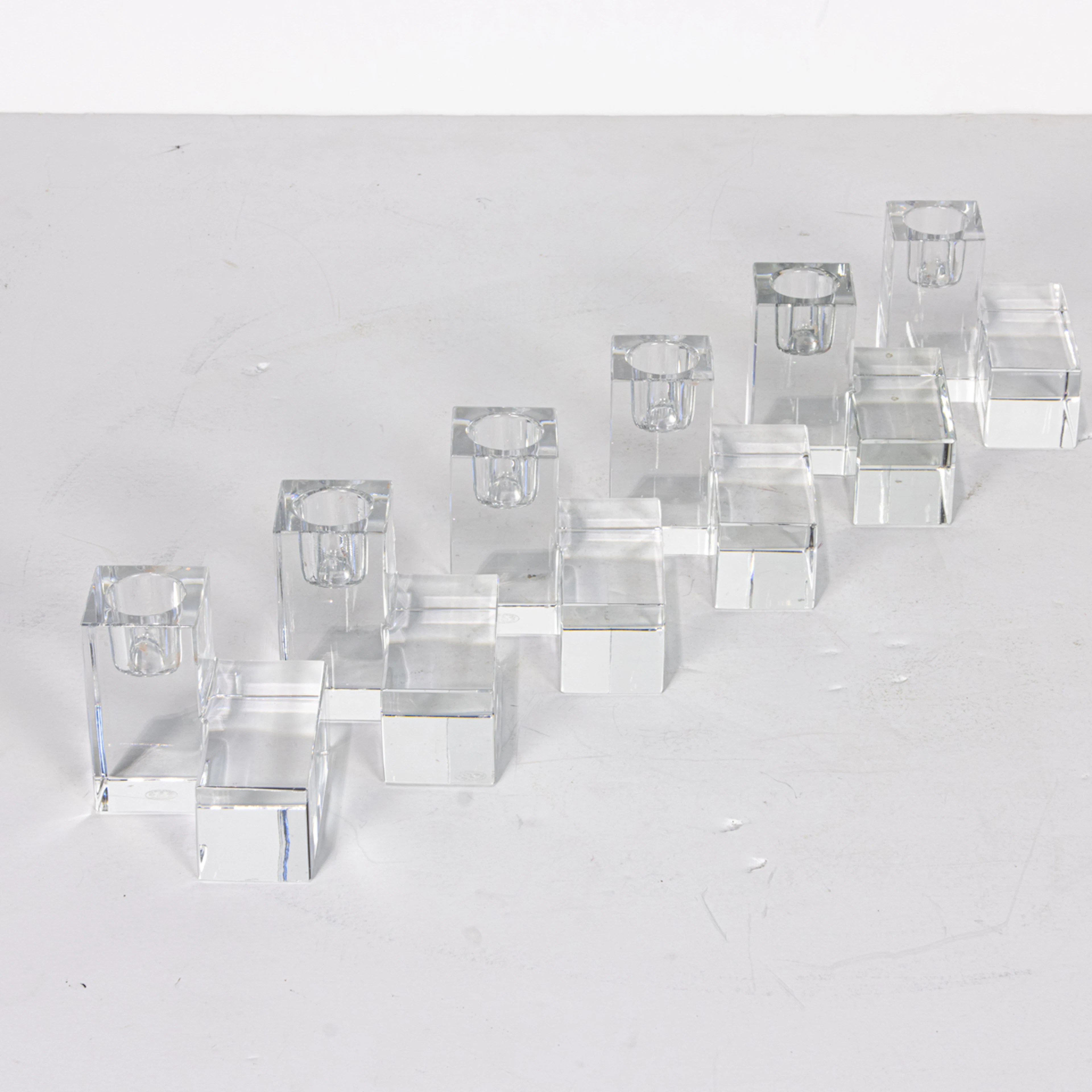Three pairs of Baccarat glass cube candlesticks