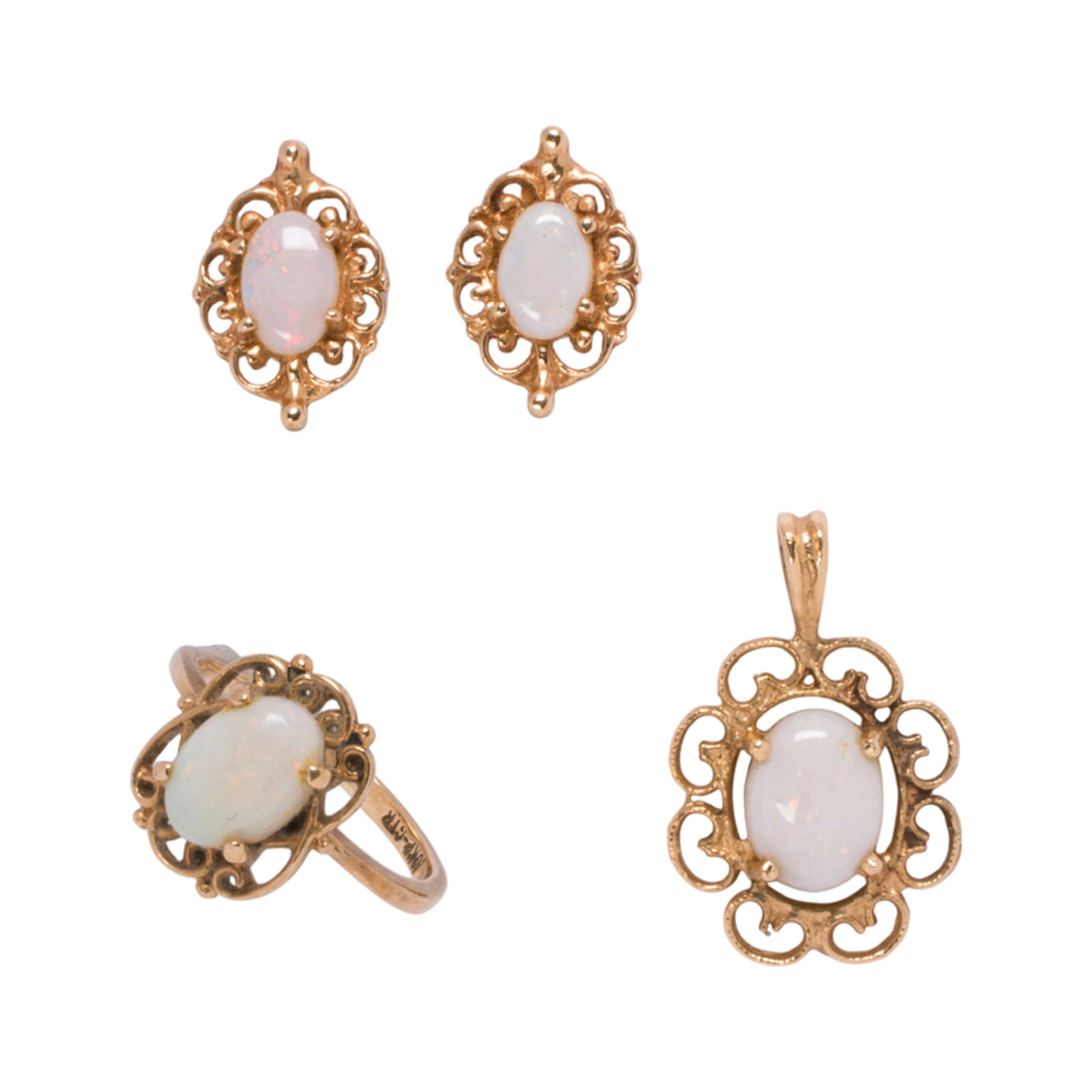 A group of opal and gold jewelry