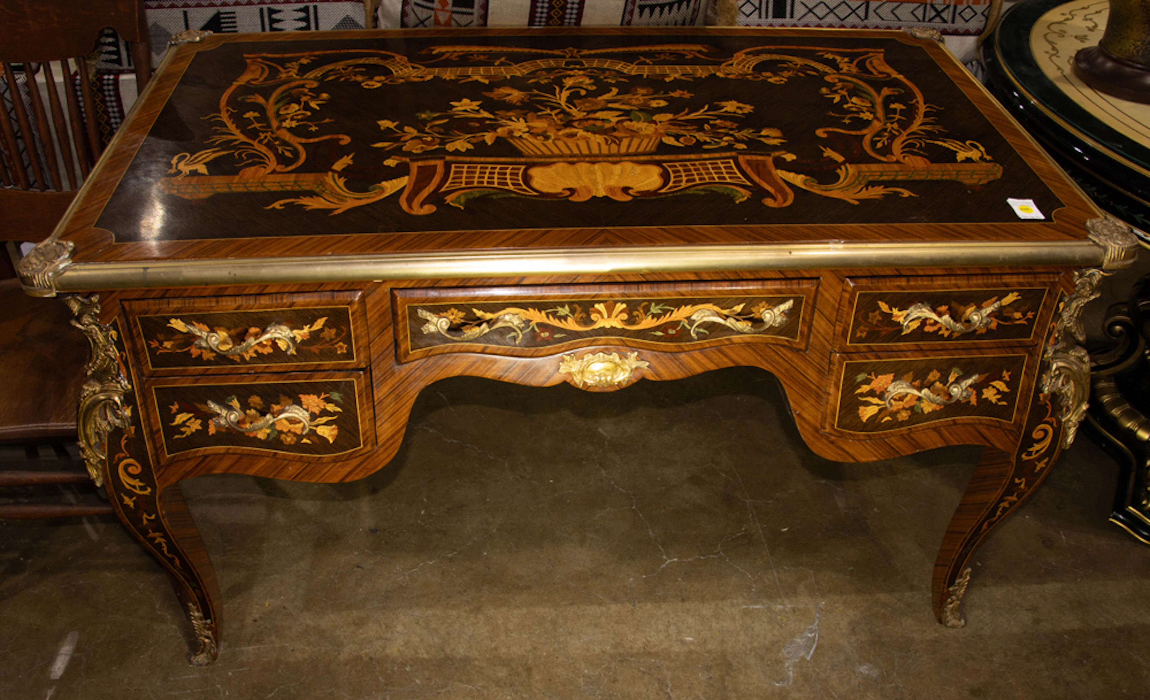 A Louis XV style gilt bronze mounted marquetry inlaid bureau plat or desk