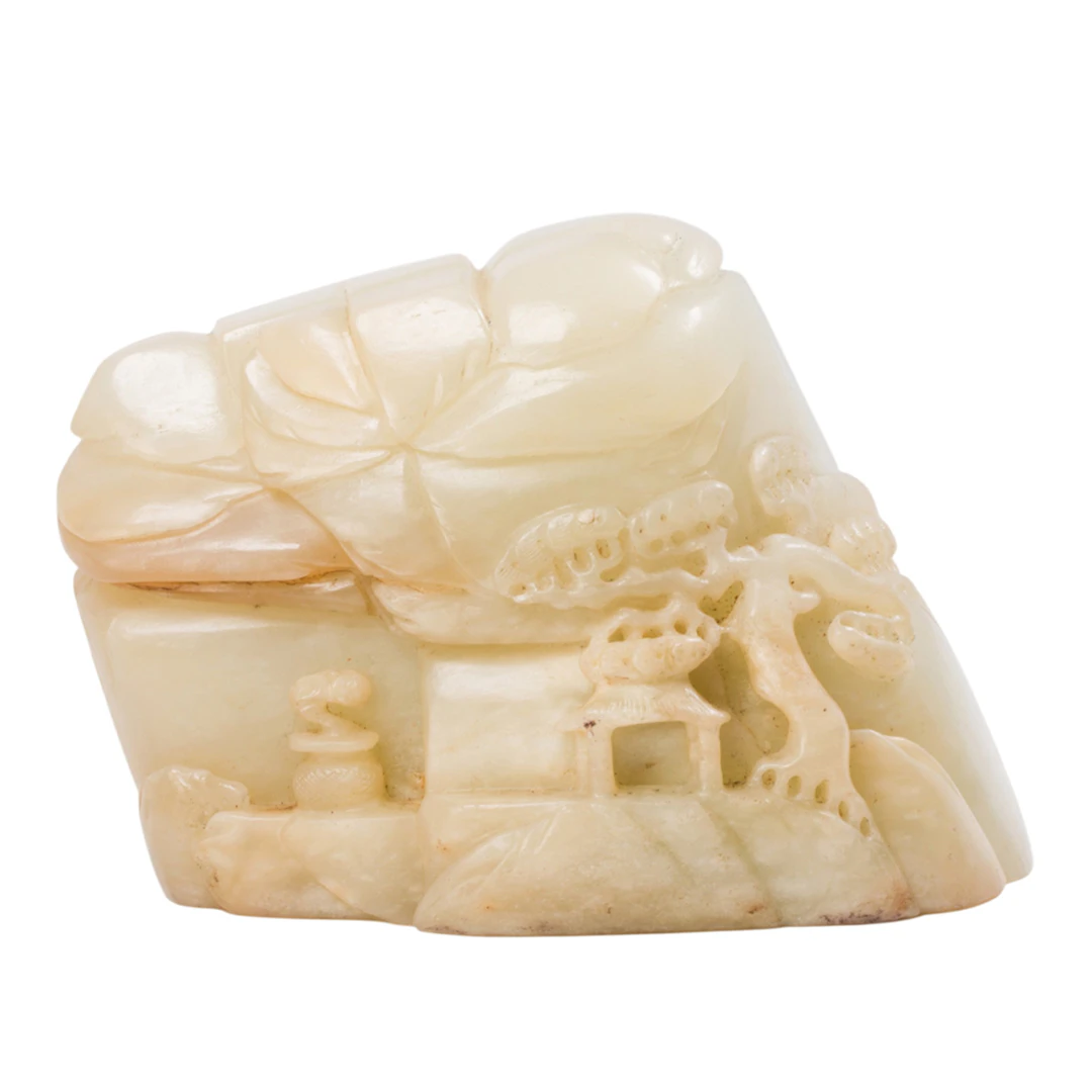 A Chinese celadon jade landscape carving