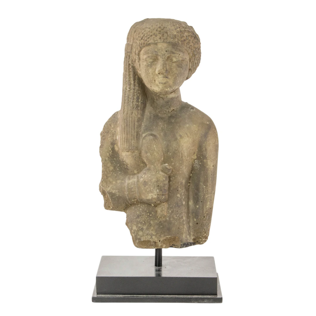 An Egyptian cast stone half length figure