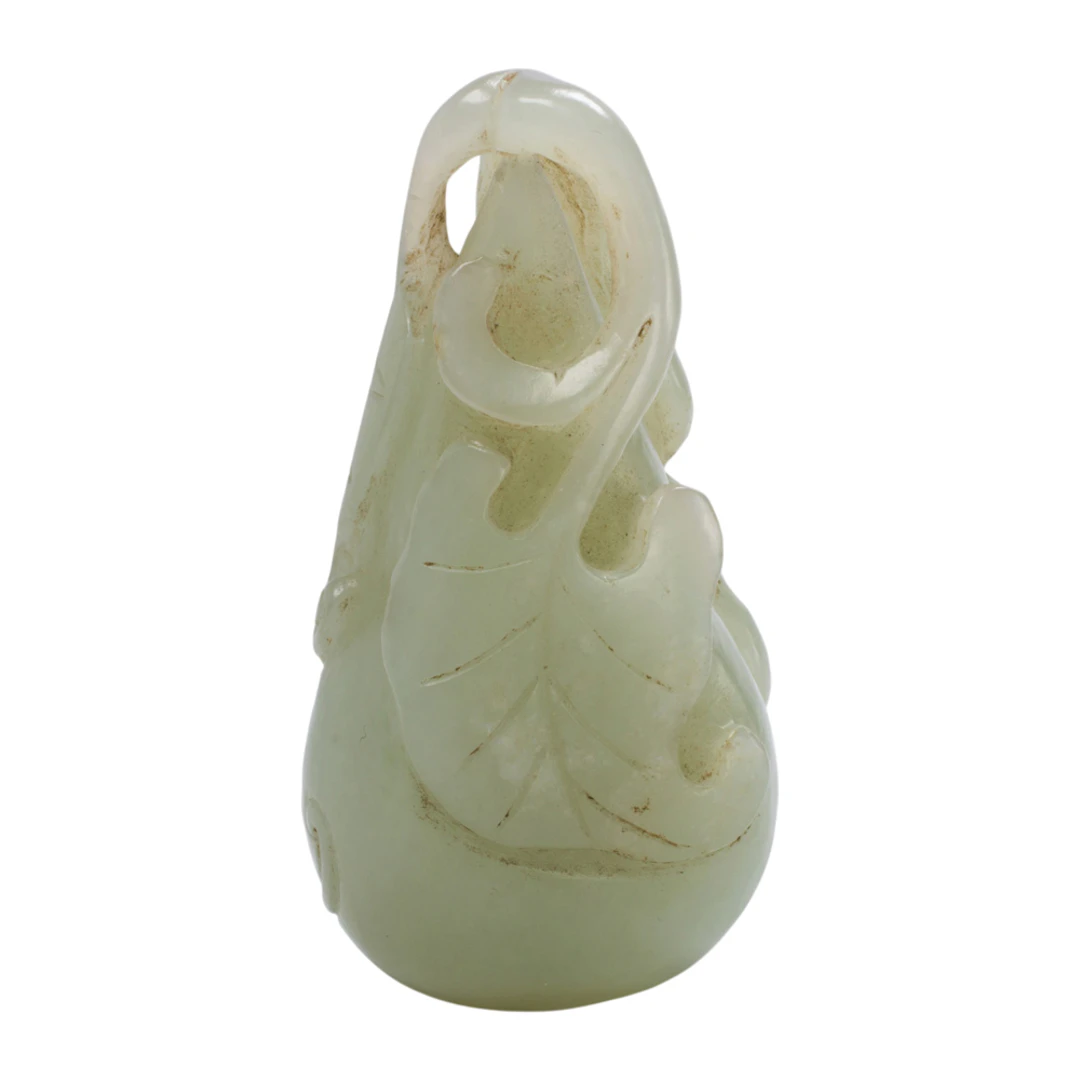 A Chinese white jade double gourd toggle