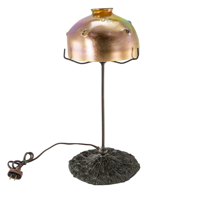A Tiffany Studios gold Favrile glass and bronze table lamp