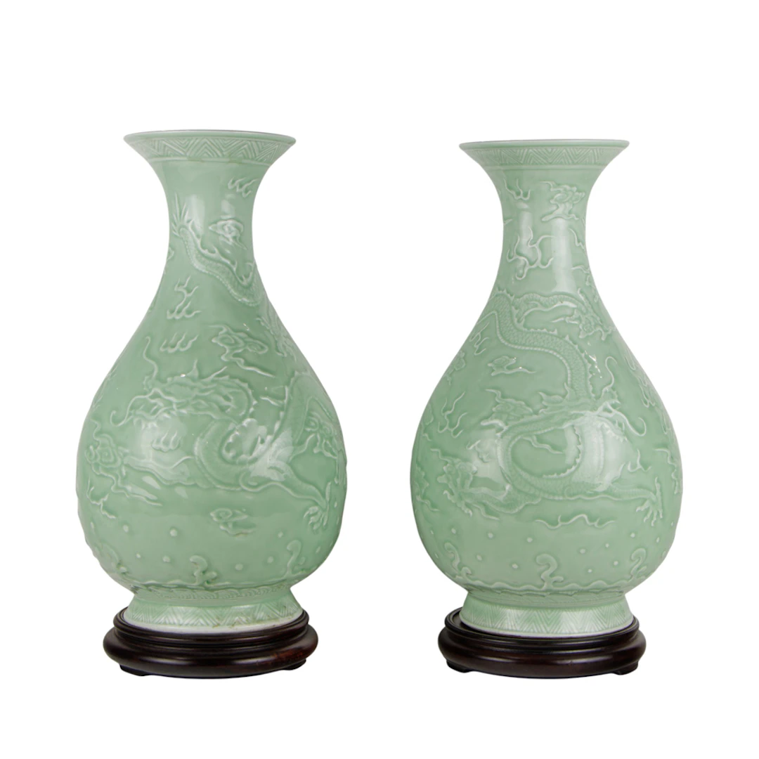 (lot of 2) Chinese celadon glazed and carved 'dragon' vases