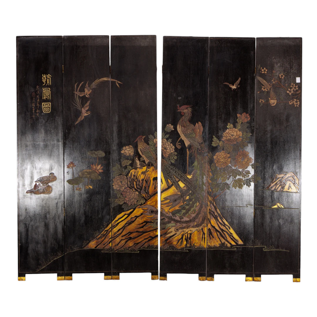 A Chinese six-panel black lacquer coromandel style folding screen