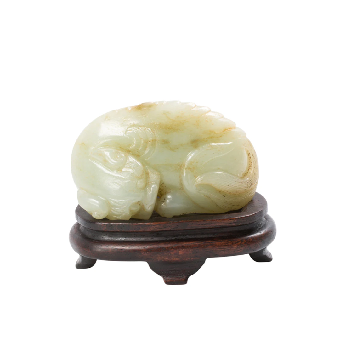 A Chinese white jade mythical beast figure
