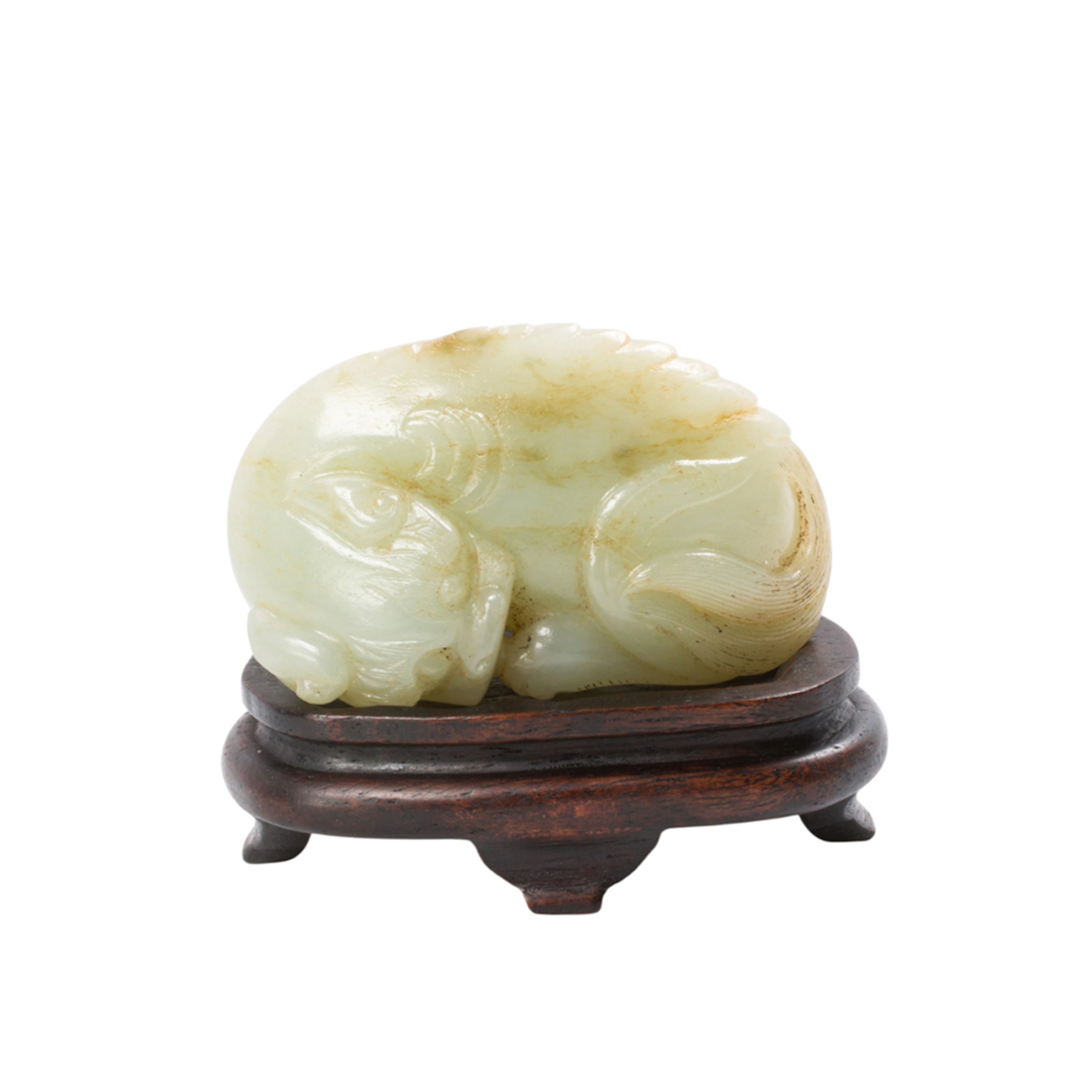 A Chinese white jade mythical beast figure