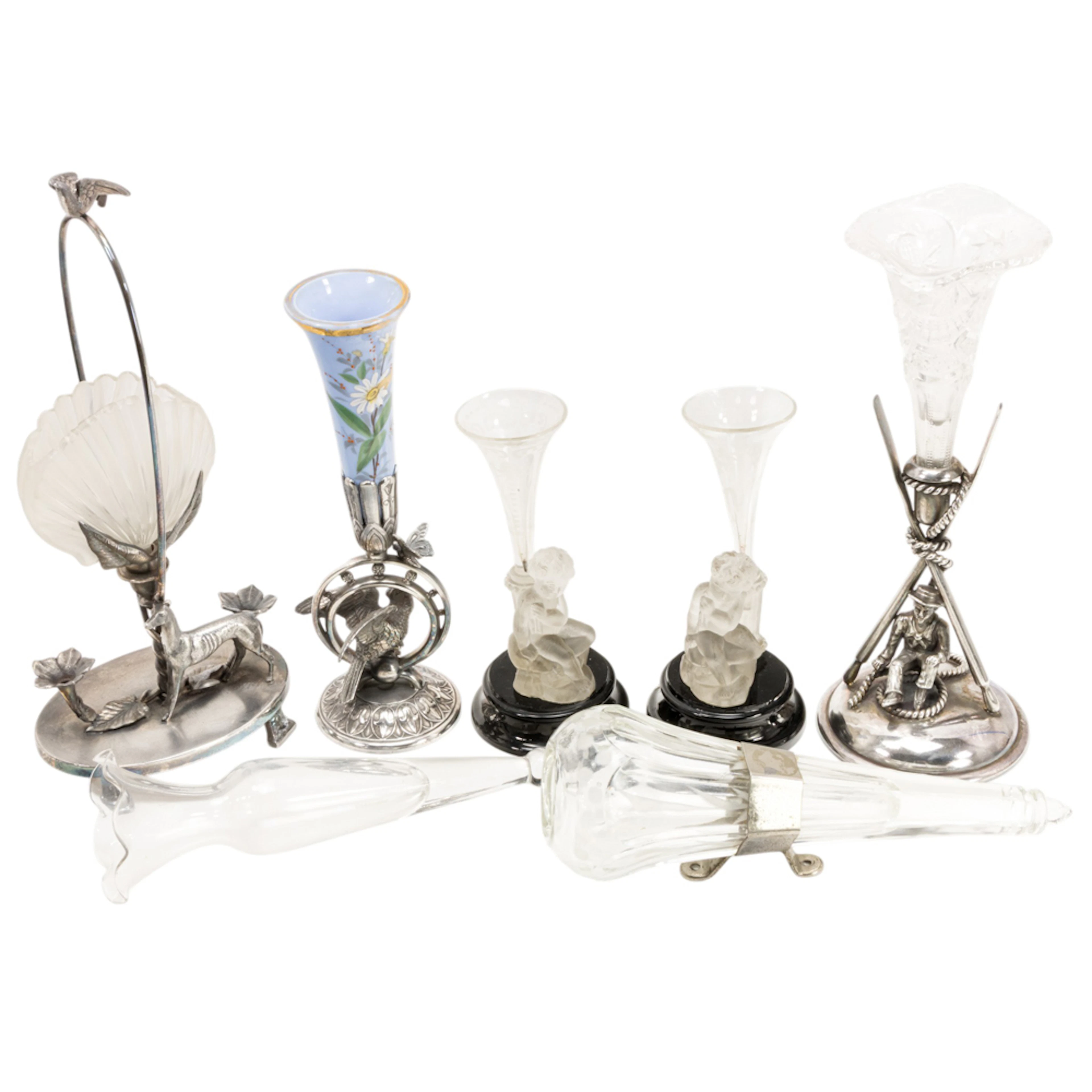 A collection of seven flower holders