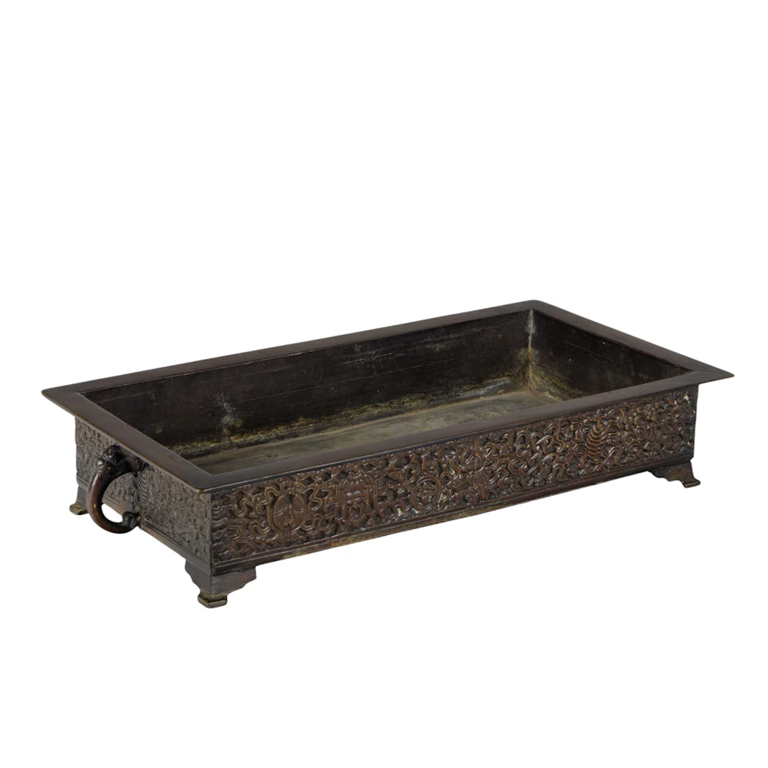 A Japanese patinated bronze suiban