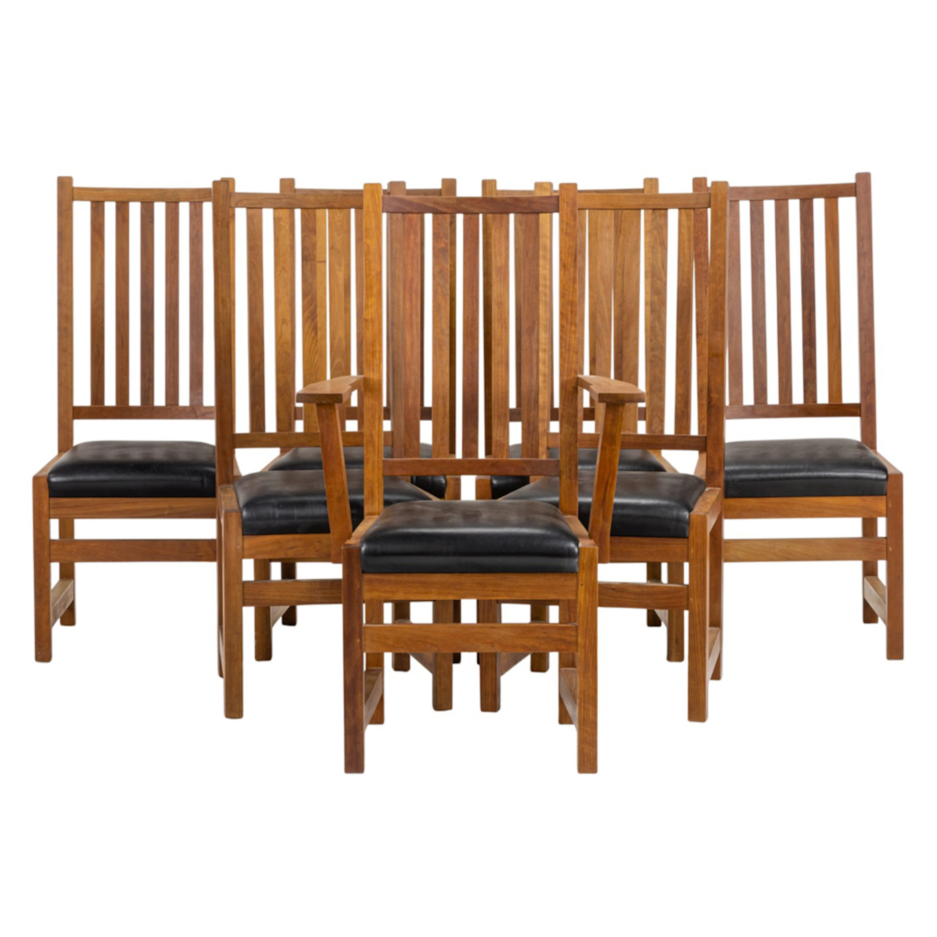 A set of seven Thomas Moser tall back dining chairs