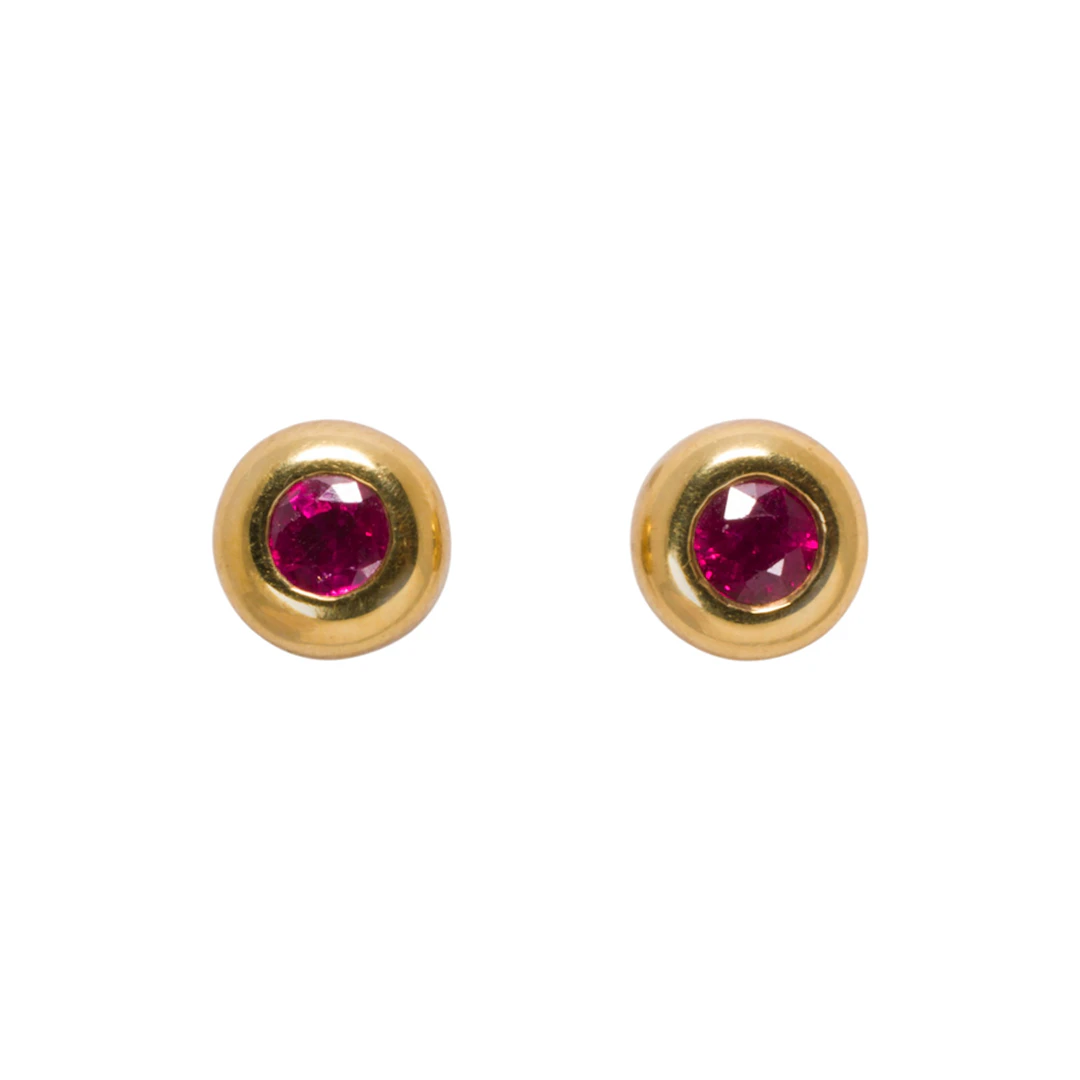 A pair of ruby, 18k gold, and platinum stud earrings