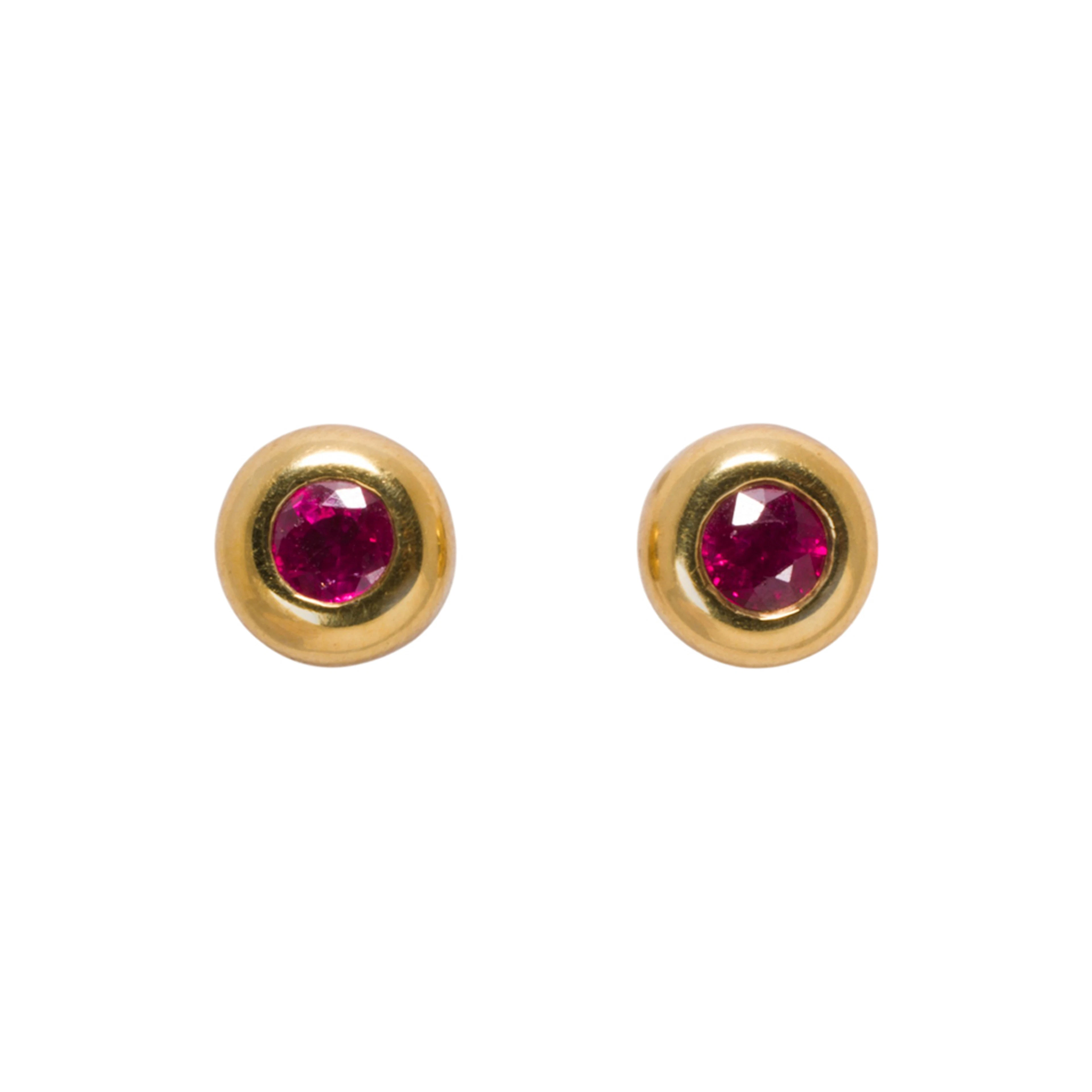 A pair of ruby, 18k gold, and platinum stud earrings
