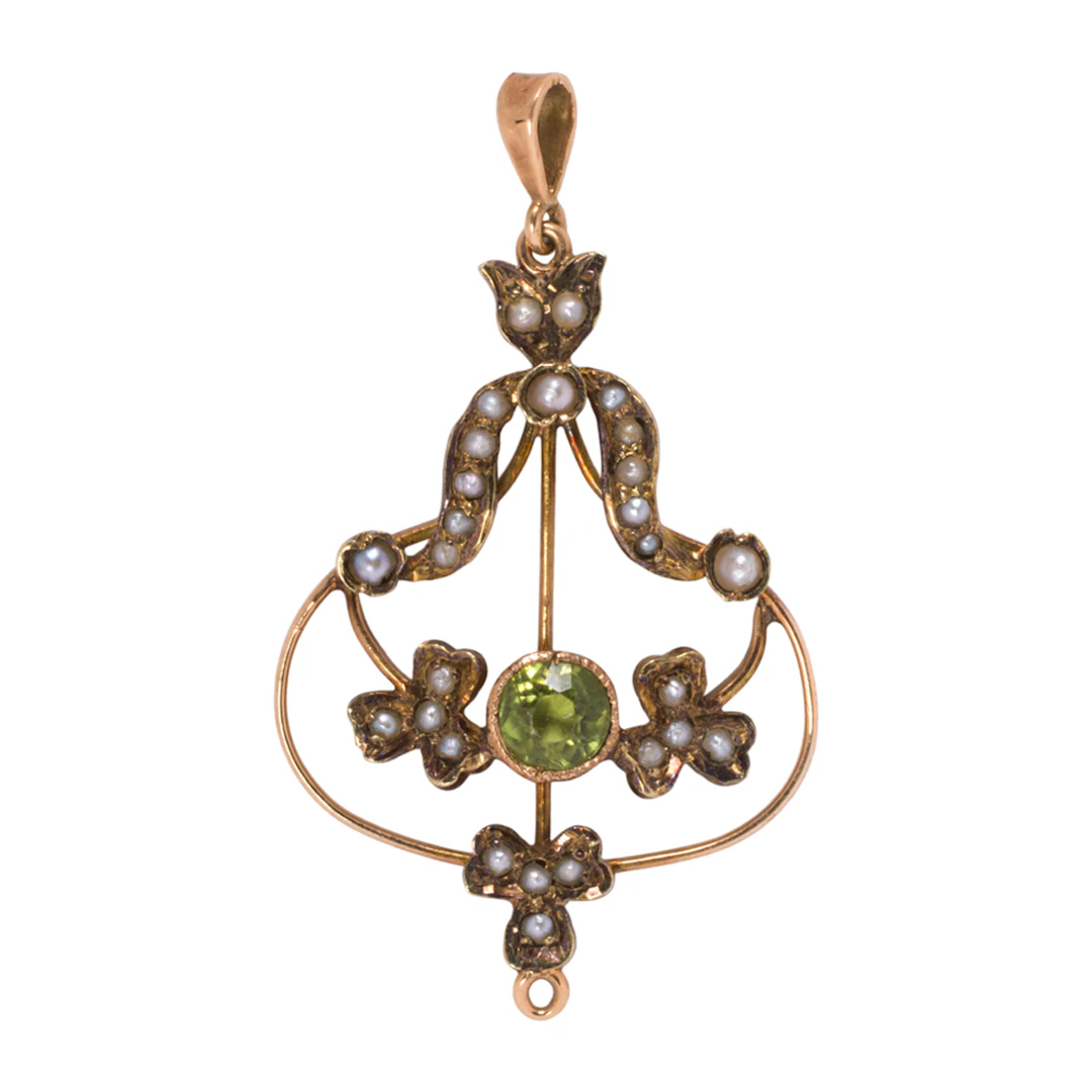 An art nouveau peridot, seed pearl and 14k gold pendant