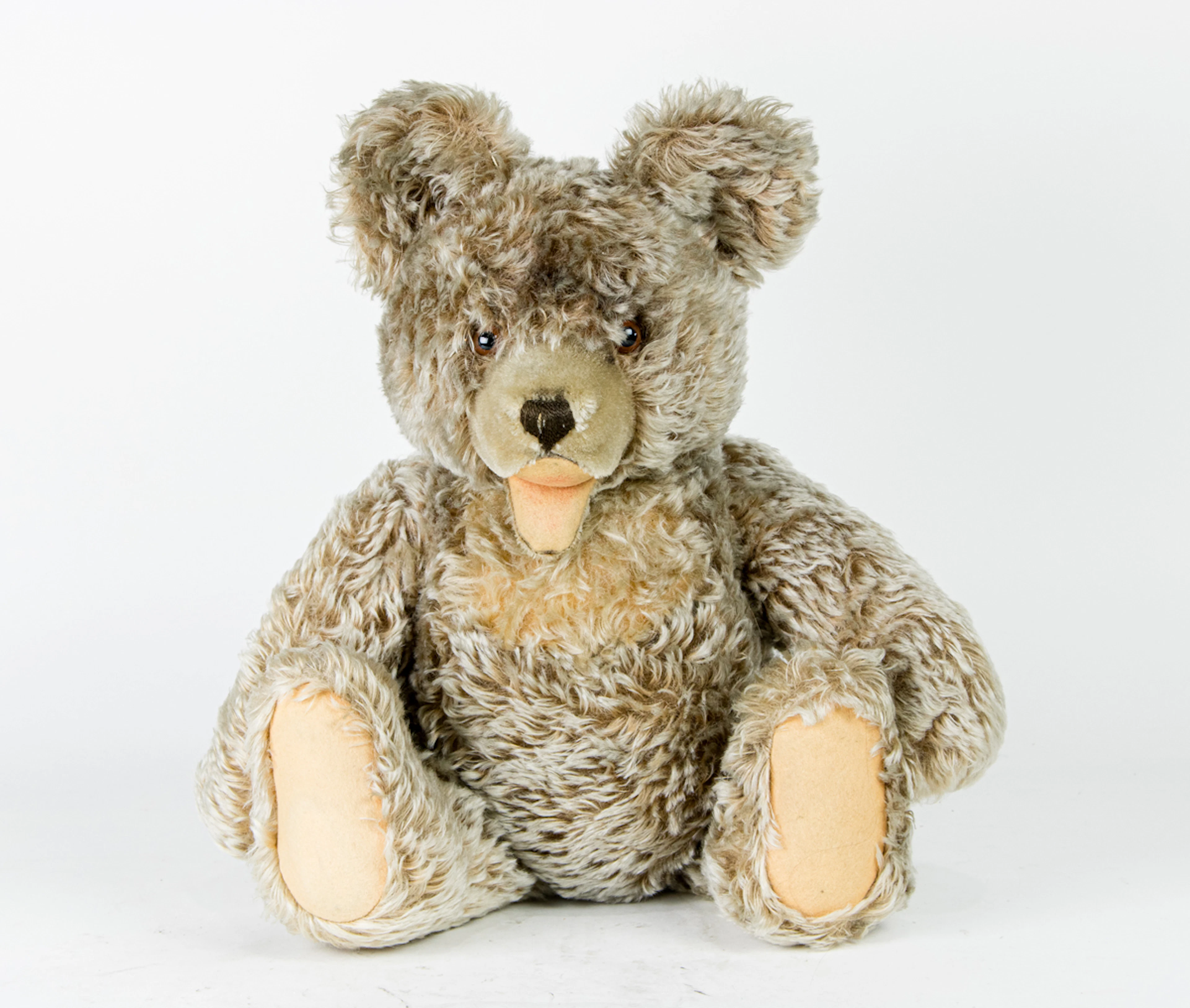 A shaggy mohair jointed bear