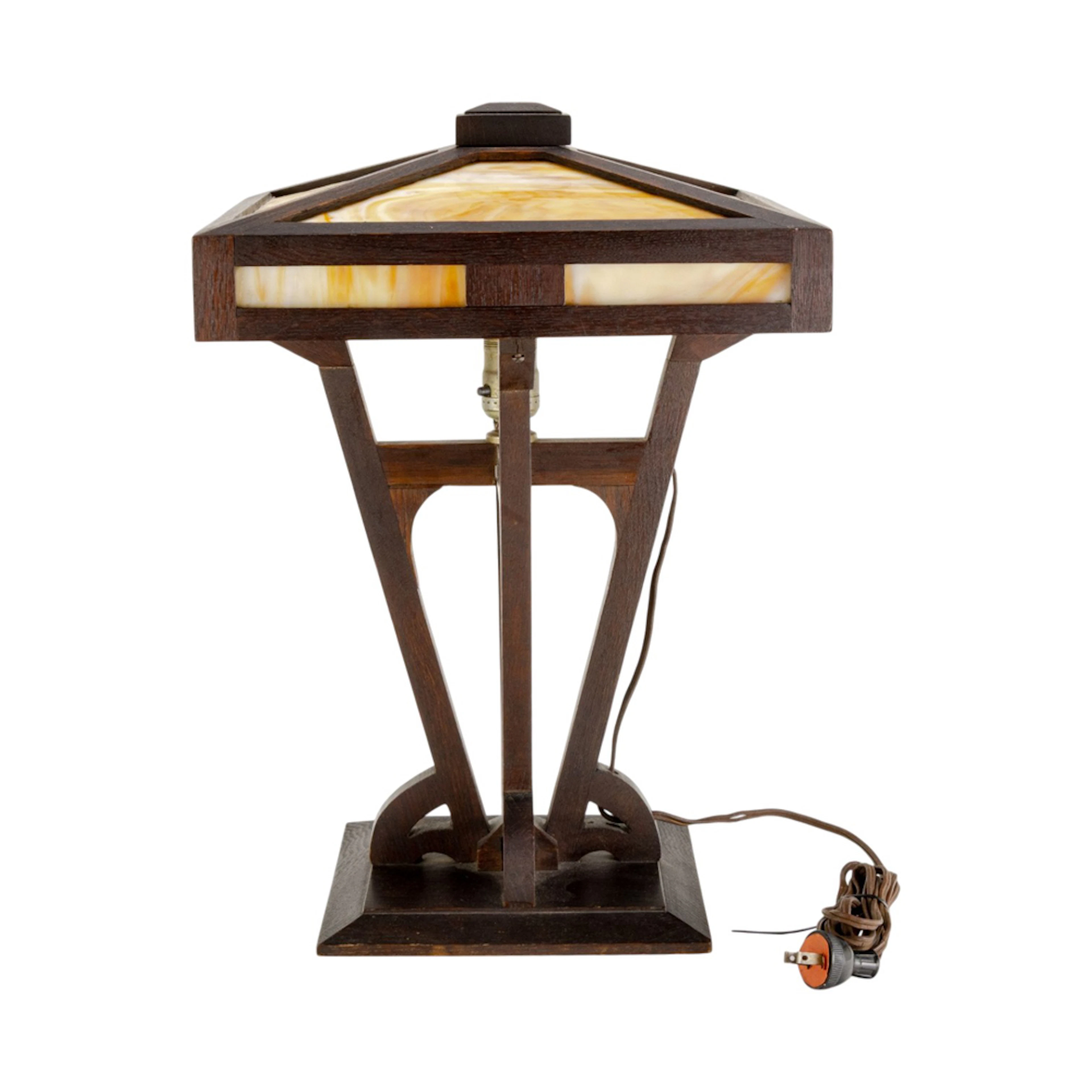 An Arts and Crafts slag glass lamp in the style of Limbert